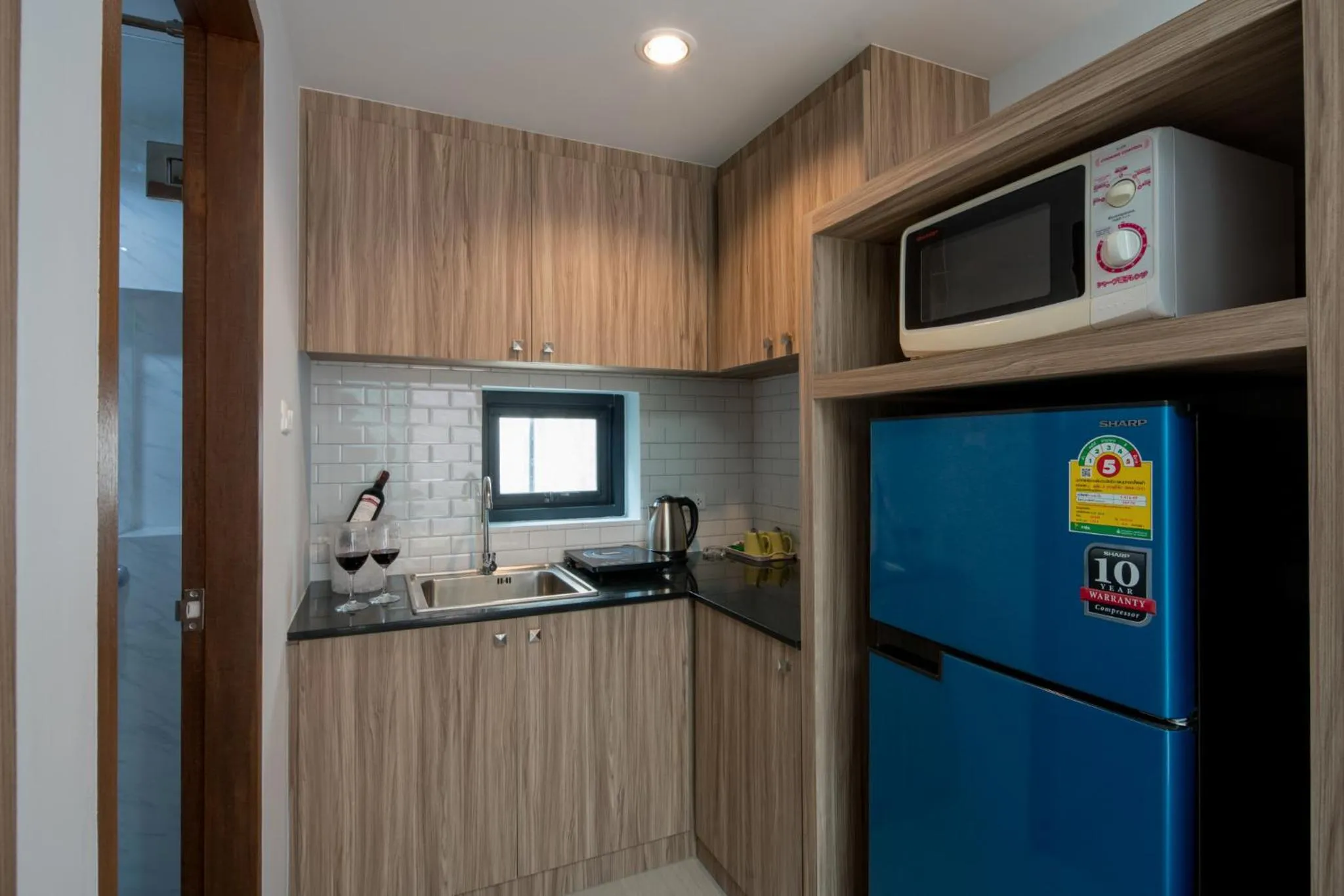 Kitchen or kitchenette in Peace Blue Naiharn Naturist Resort Phuket SHA Extra Plus
