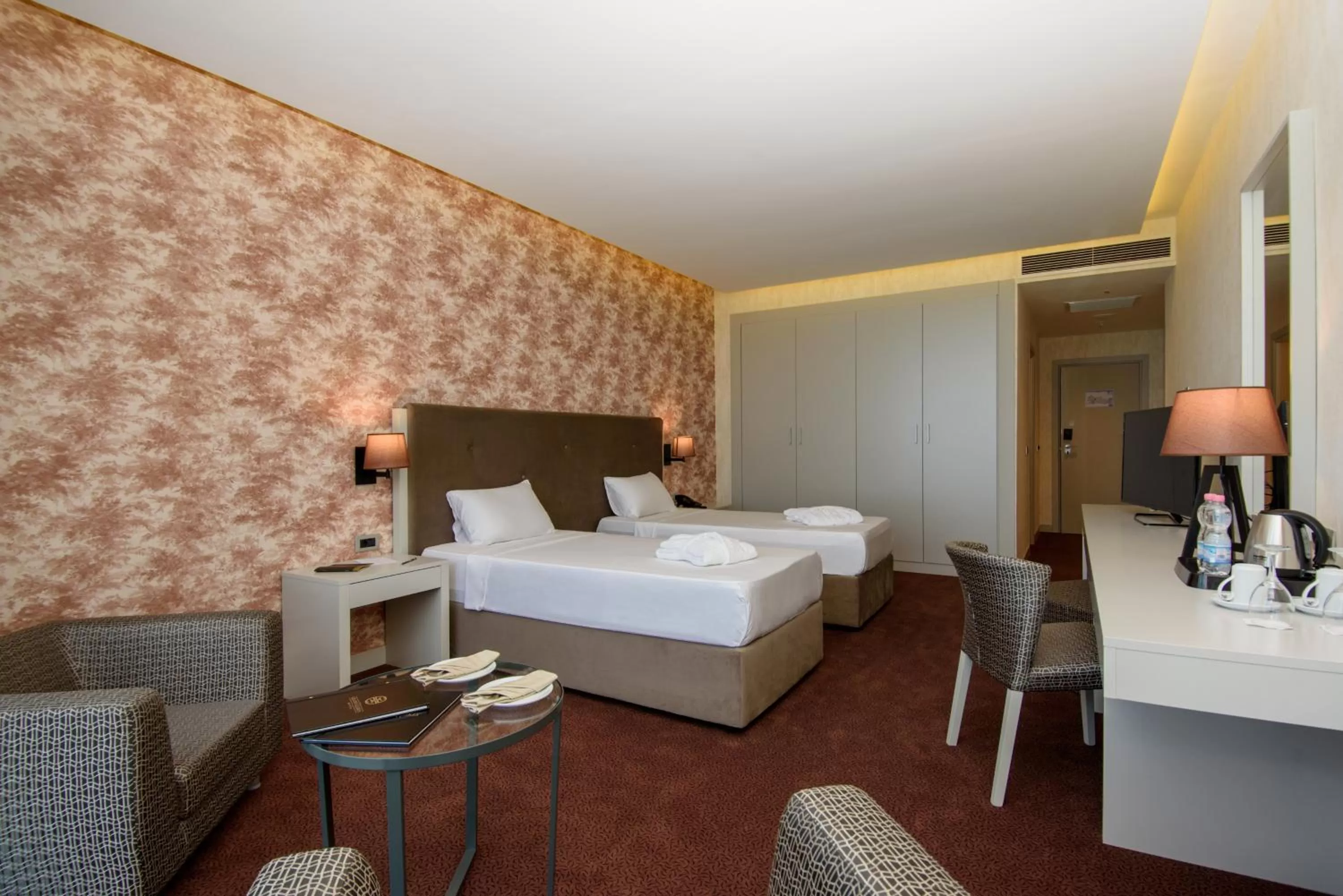 Bed in The Grand Gloria Hotel