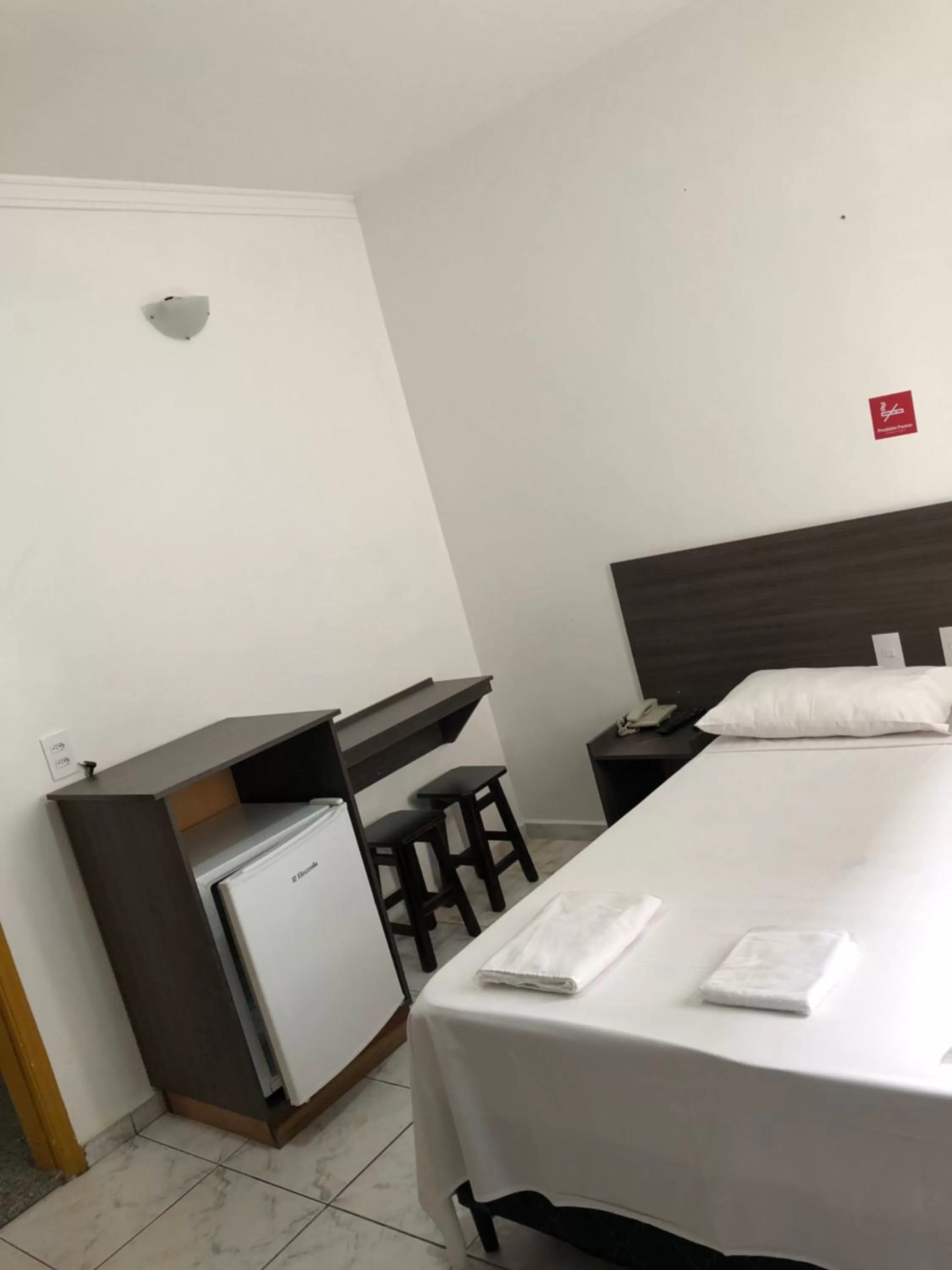 Bed in Center Plaza Hotel