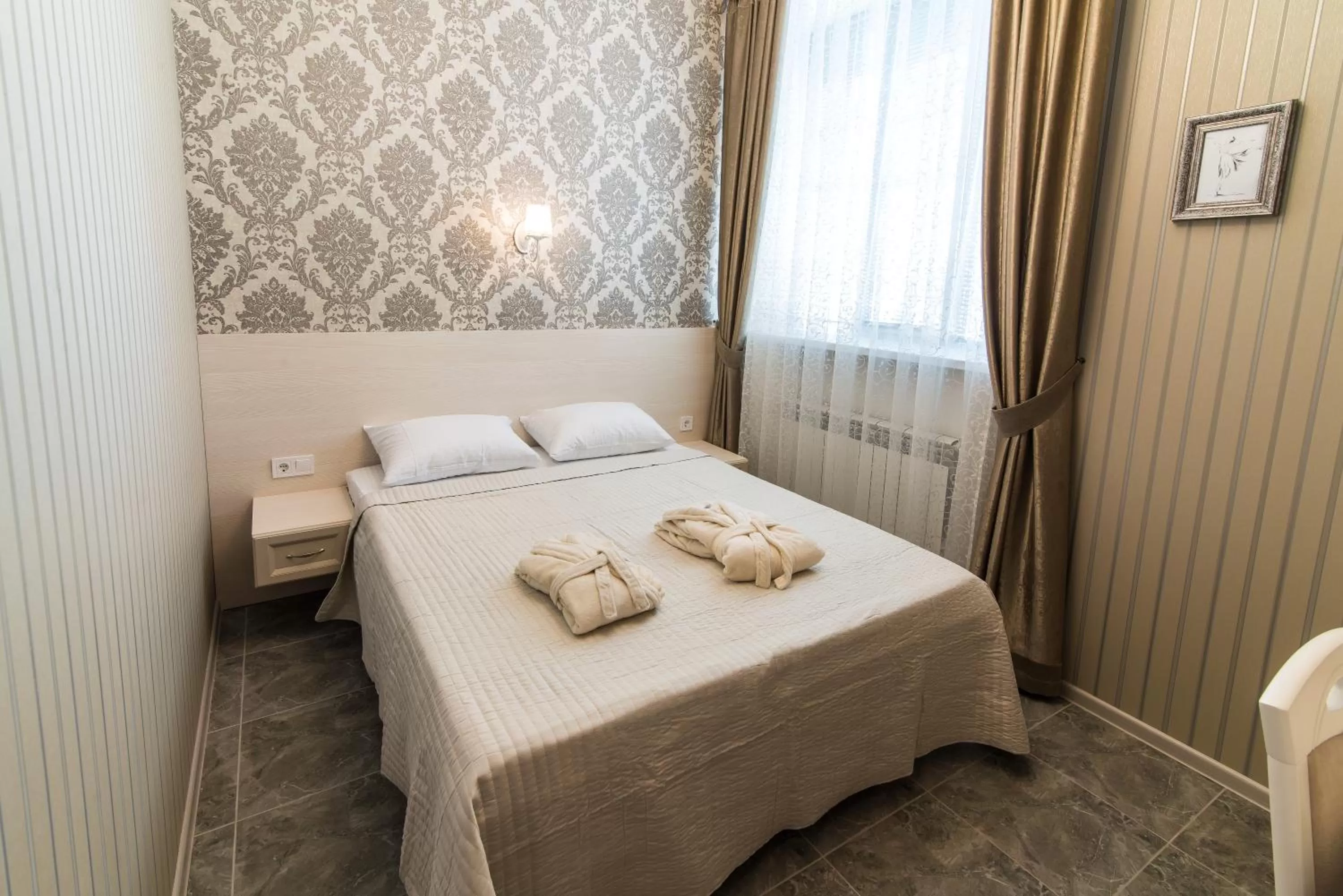 Bed in L.O.Y Family Hotel