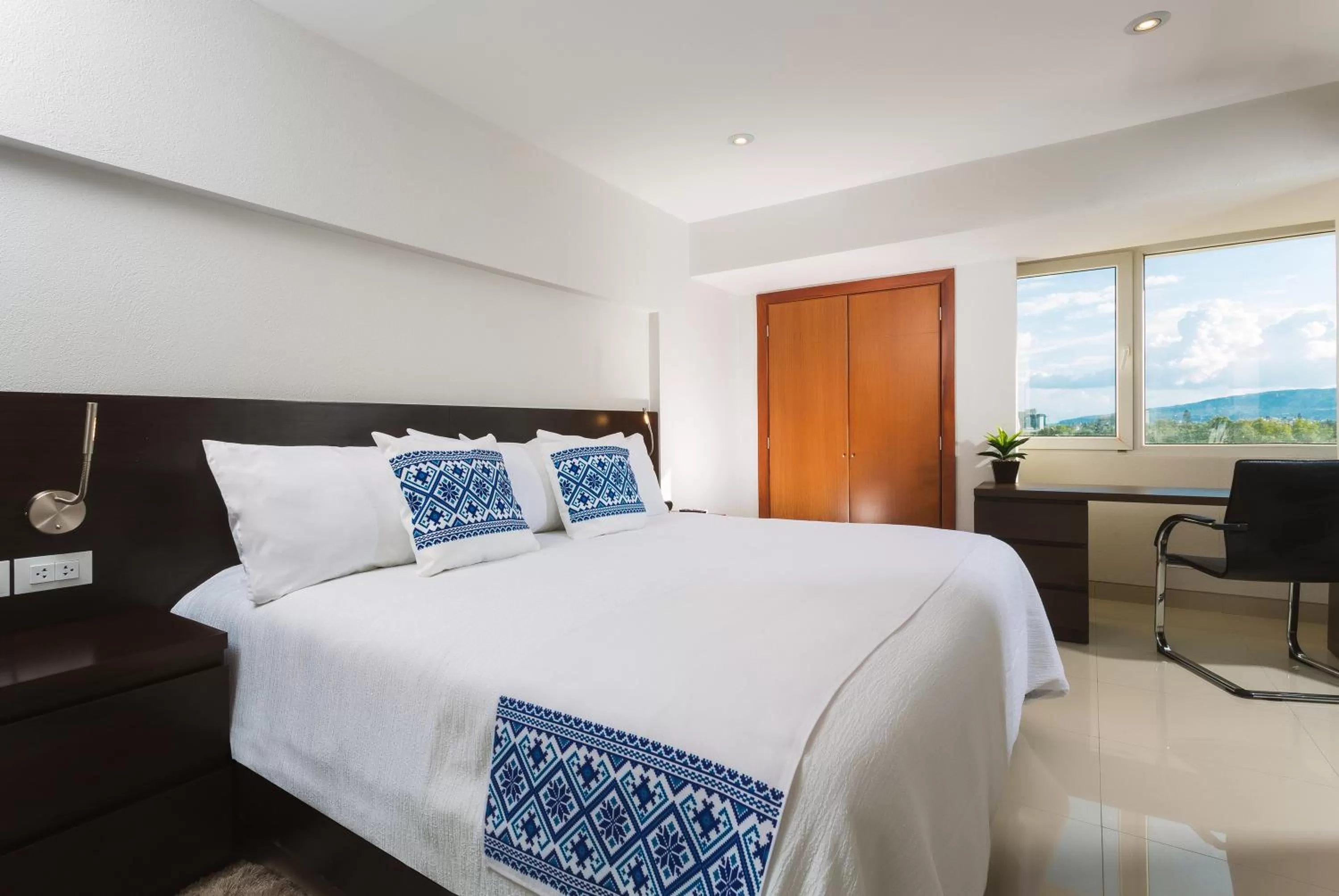 Bed in Hotel Indigo Guadalajara Expo by IHG