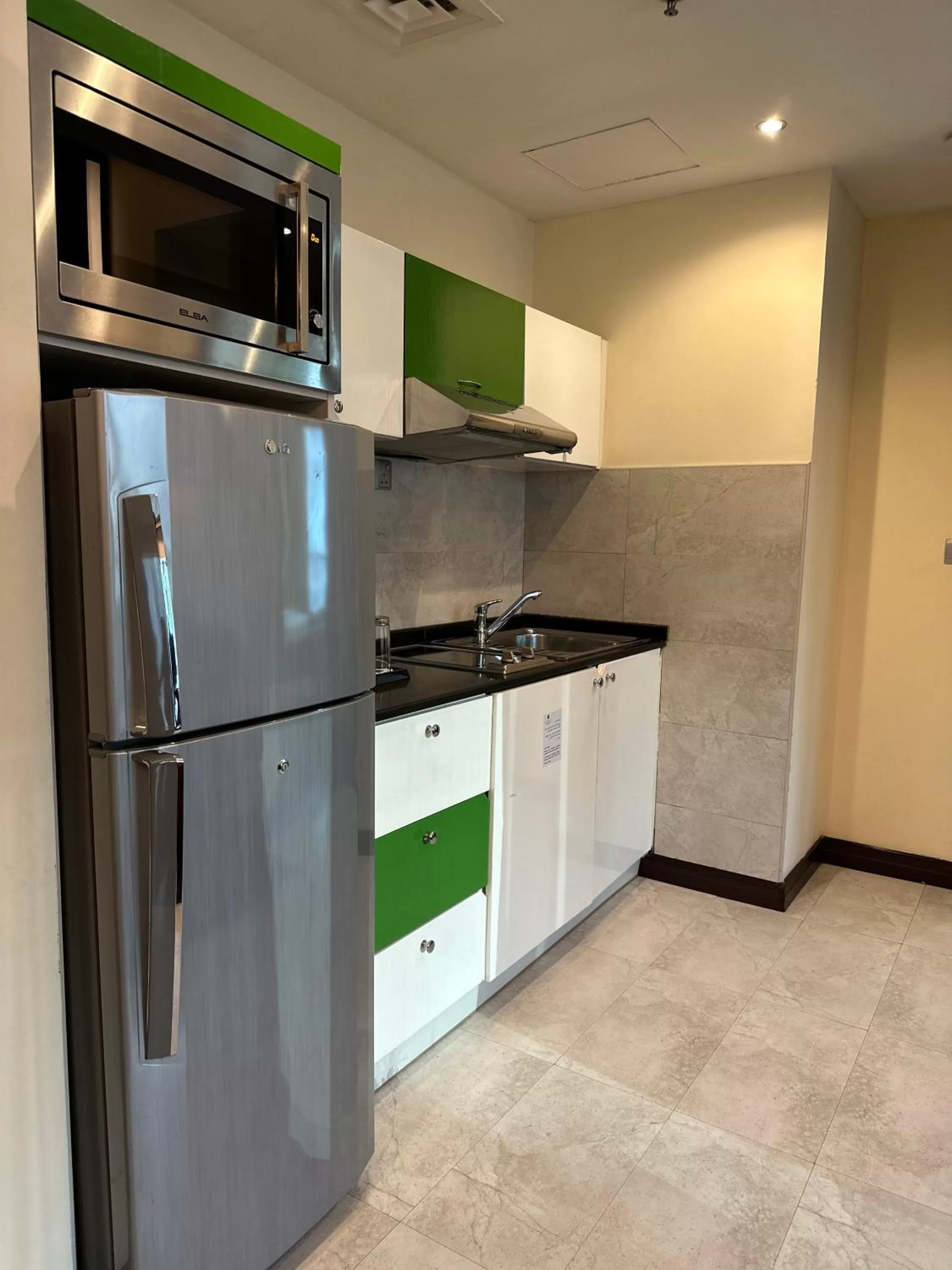 Kitchen or kitchenette in Marina View Deluxe Hotel Apartment