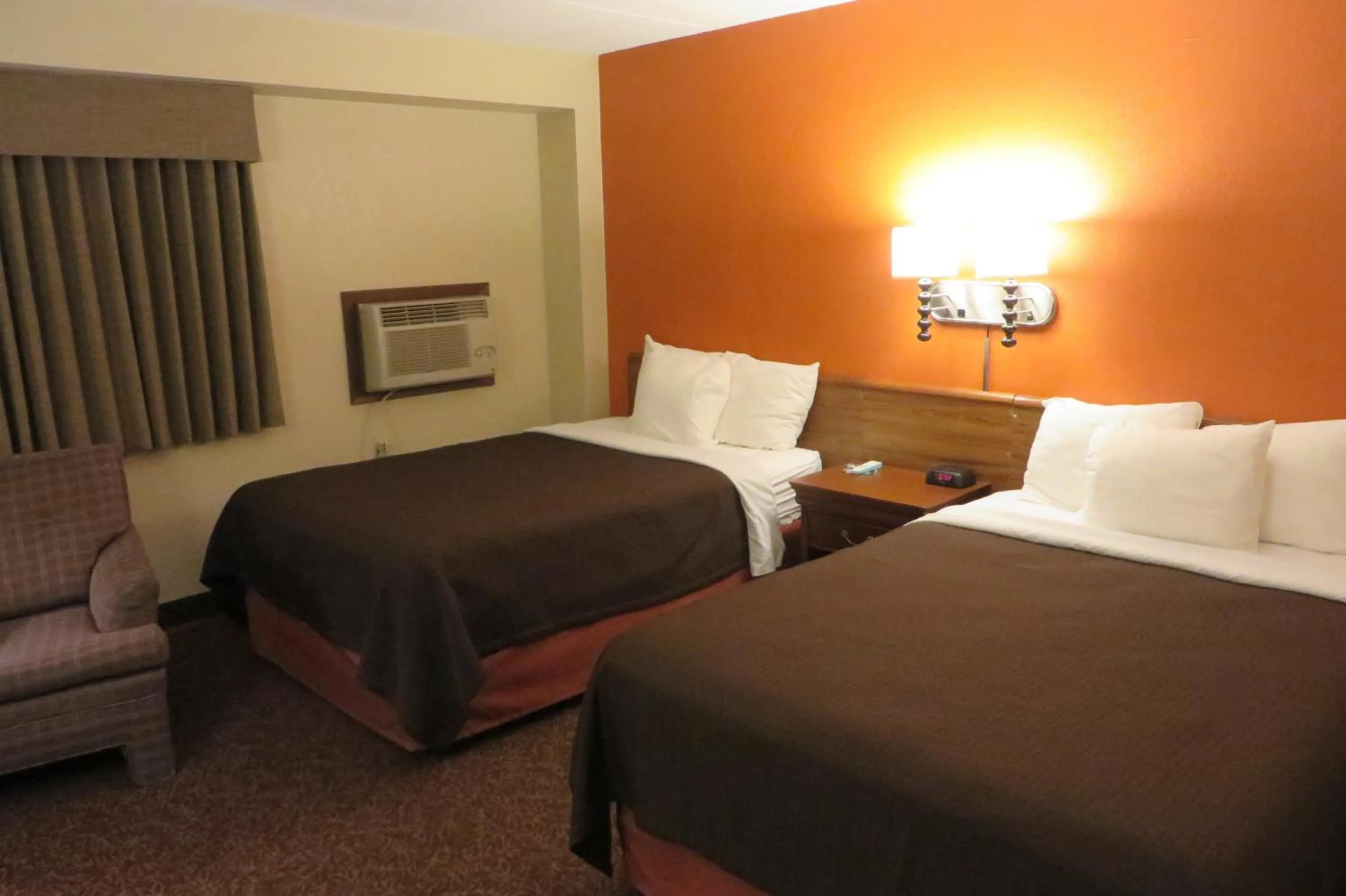 Bed in AmericInn by Wyndham Forest Lake