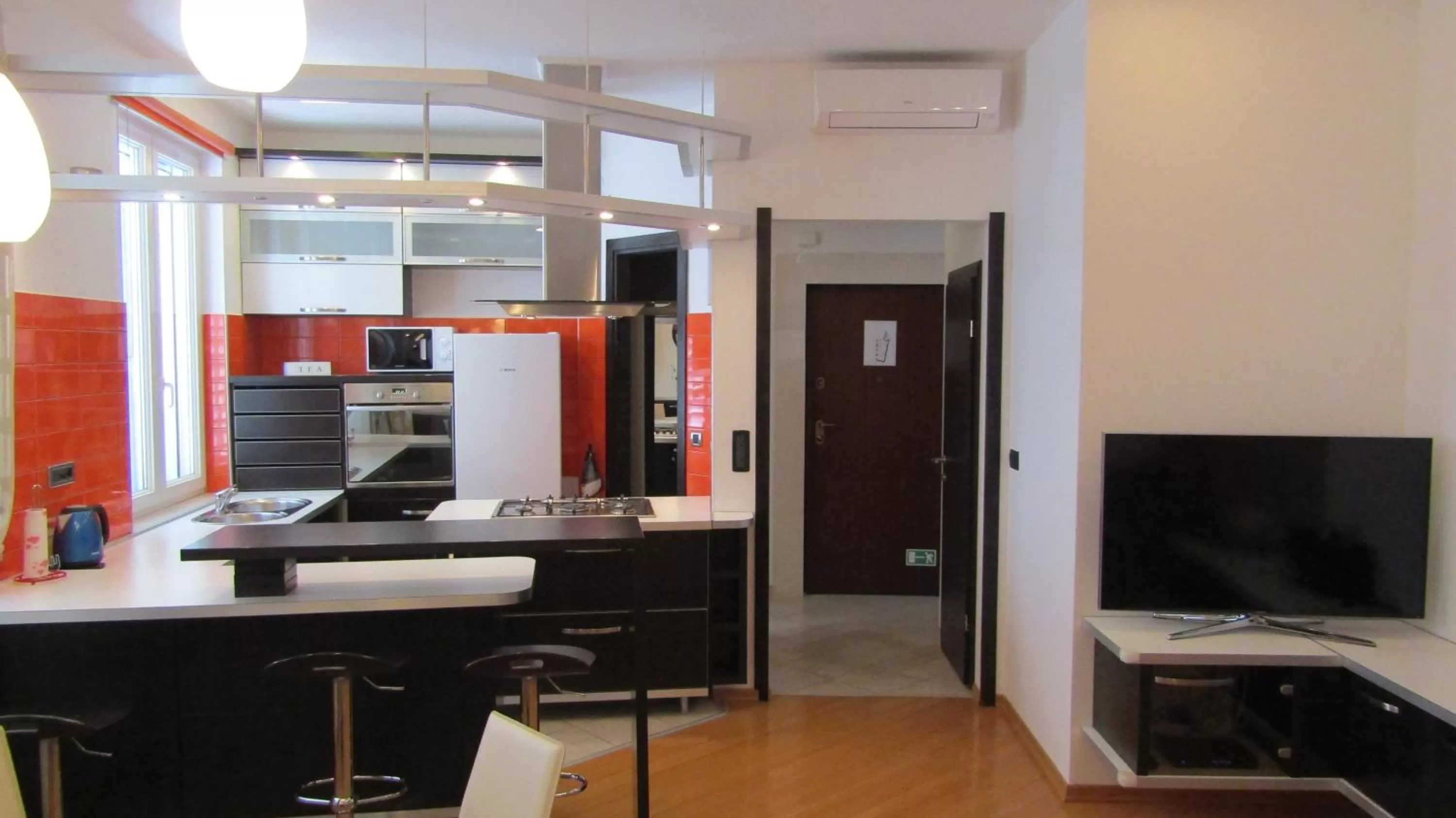 Kitchen or kitchenette, TV/Entertainment Center in Deluxe Collection Hotel Kastel