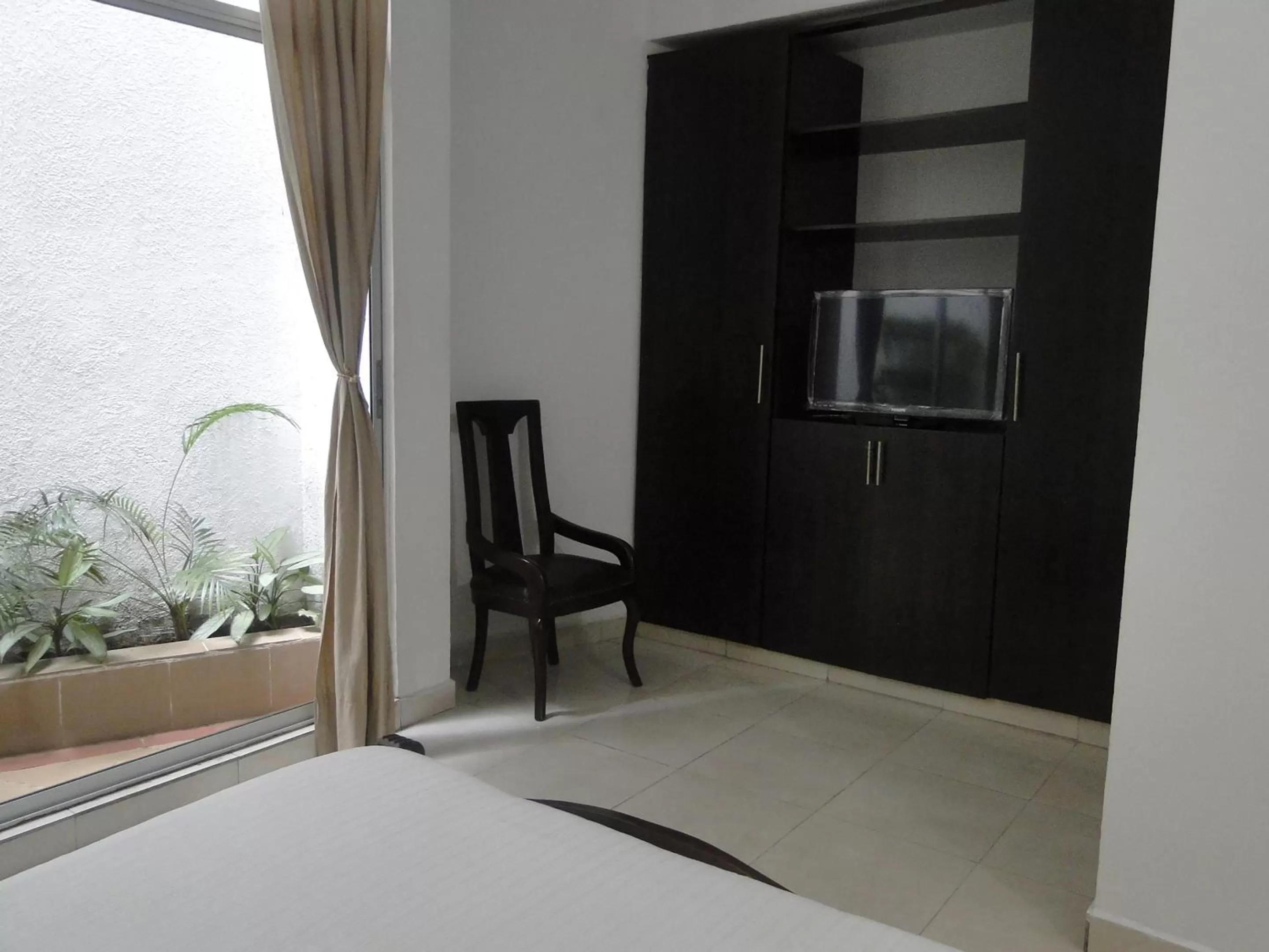 Bed in Arco Apartasuites