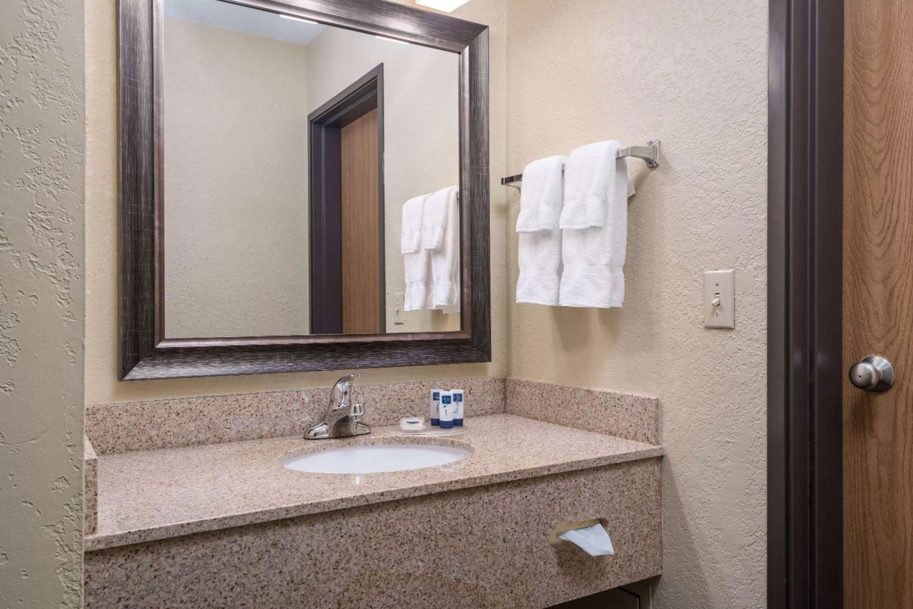 Bathroom in AmericInn by Wyndham Fargo West Acres