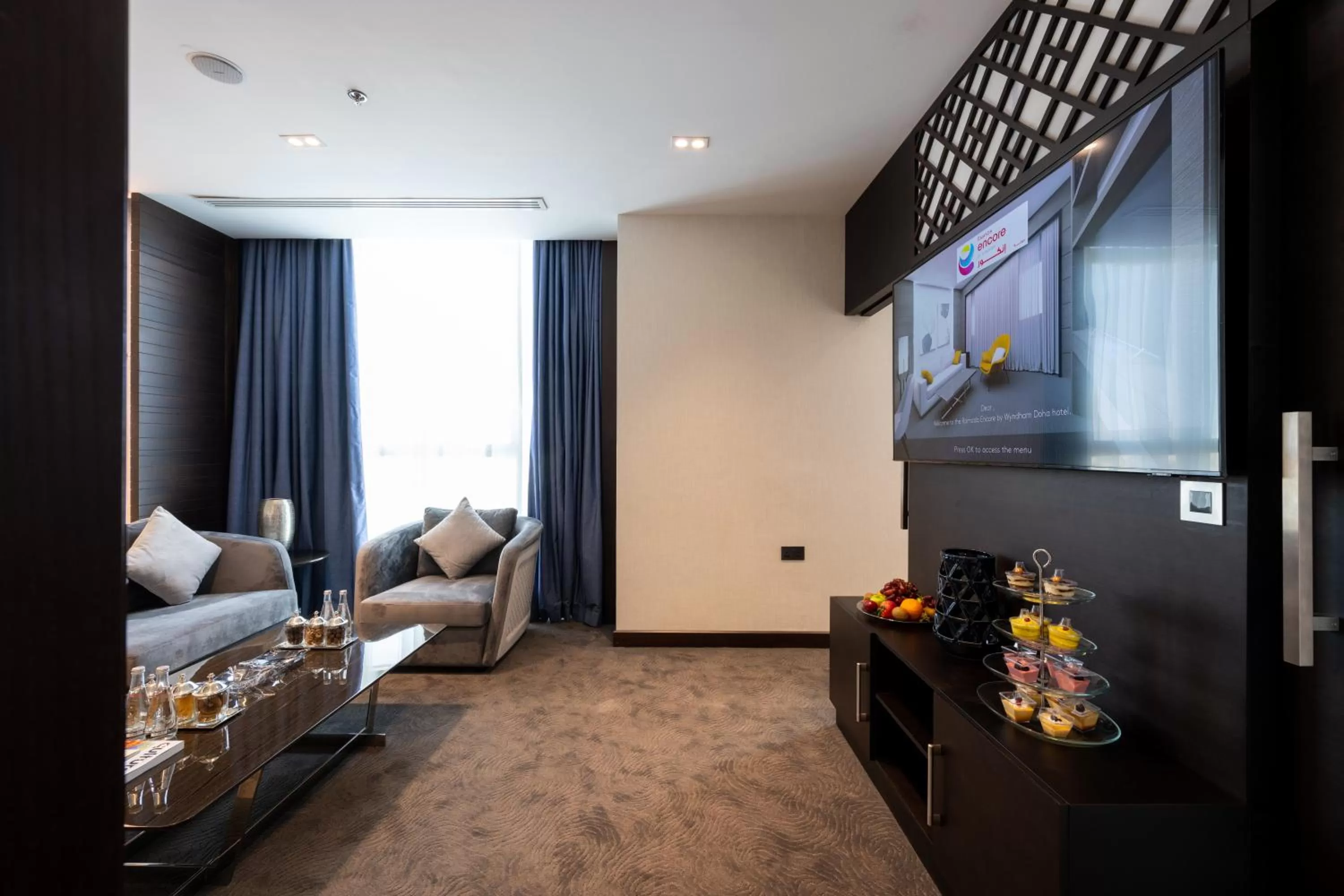 Living room in Ramada Encore Doha by Wyndham