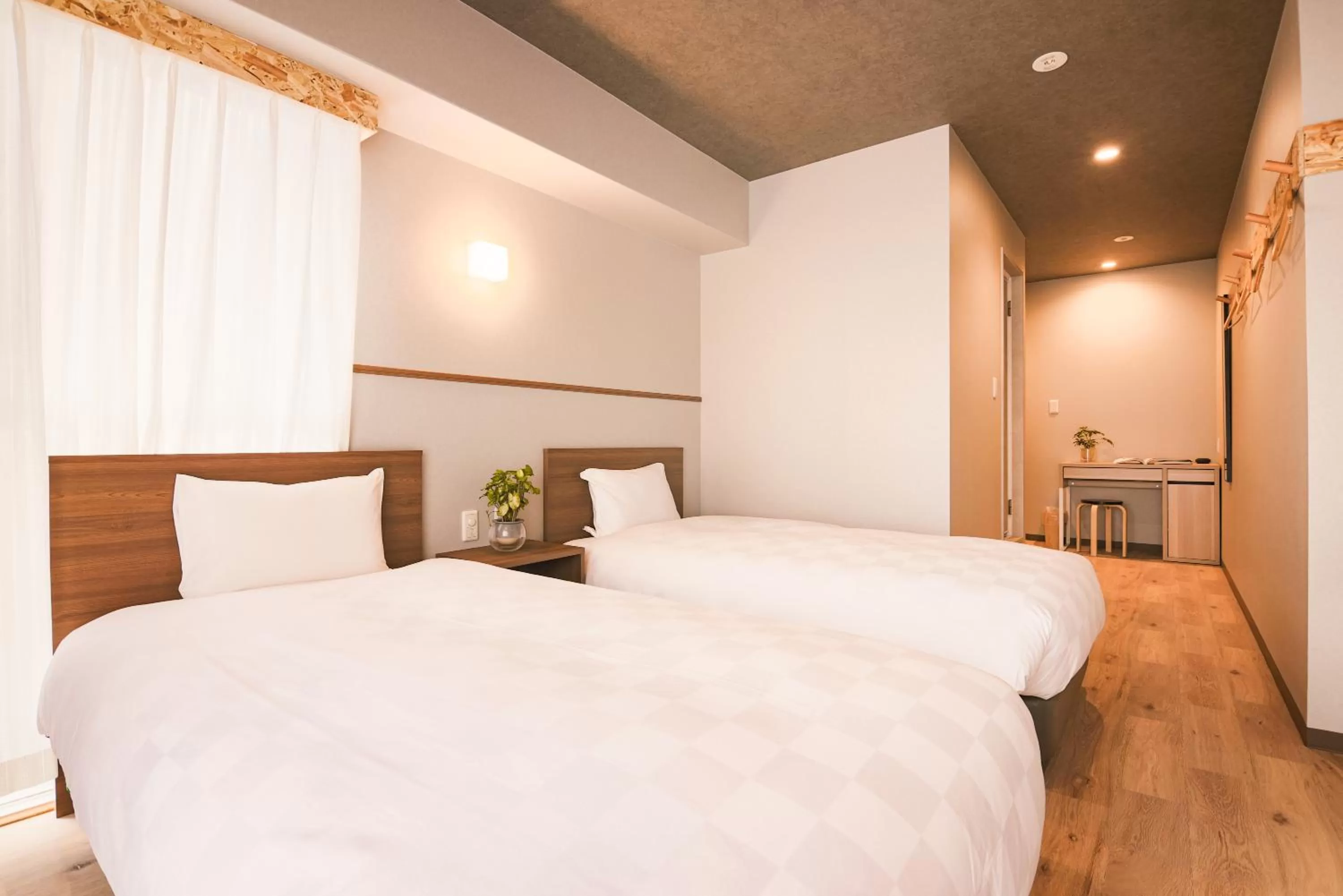 Bed in WAYFARER Kyoto Shijo