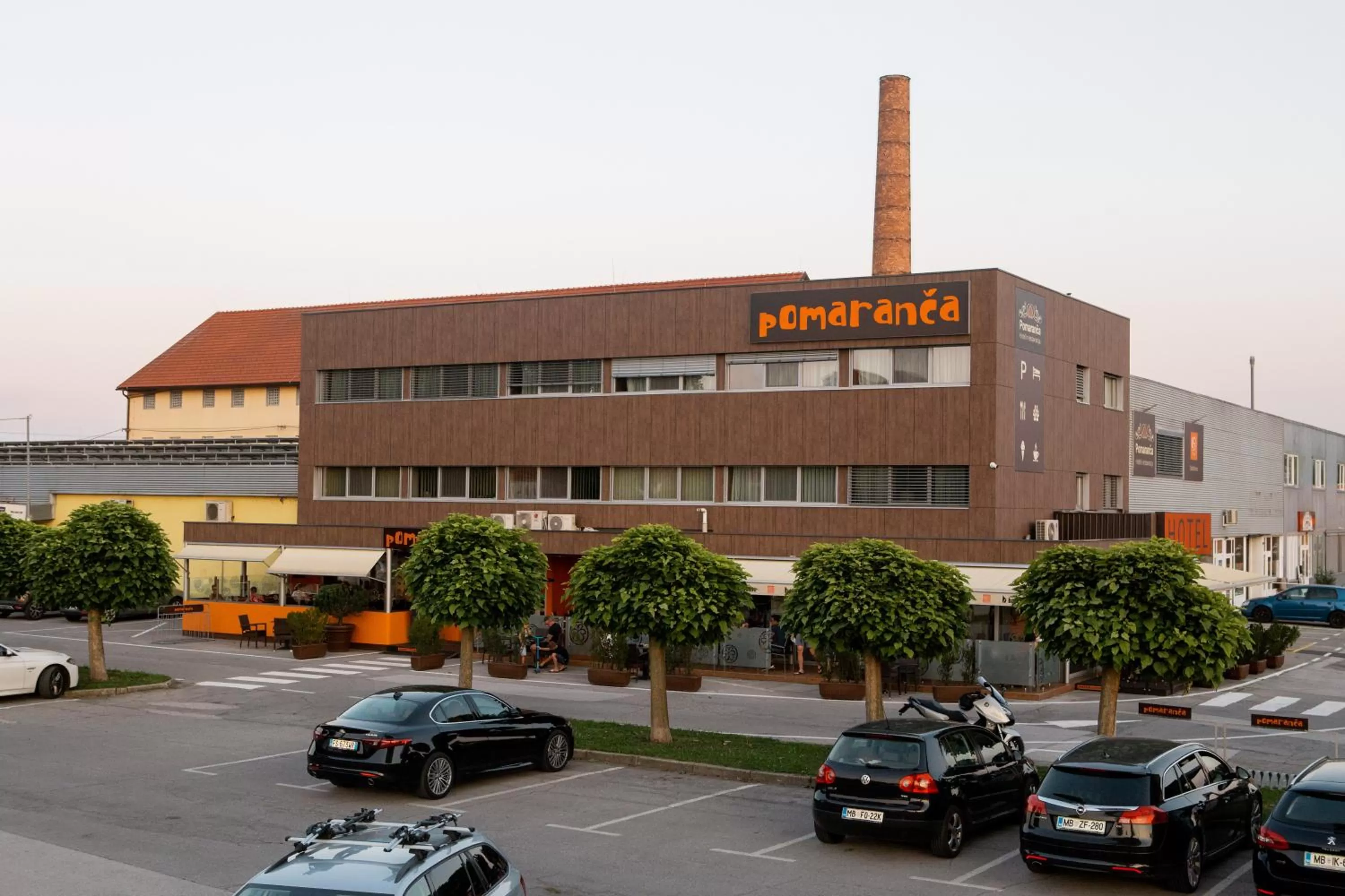 Property logo or sign in Hotel Pomaranča