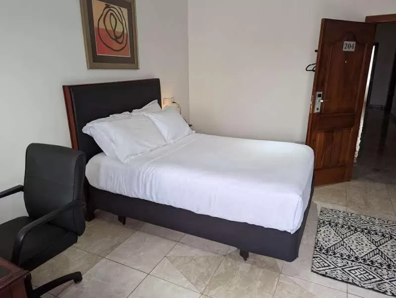 Photo of the whole room, Bed in KoKo Palm Inn LTD