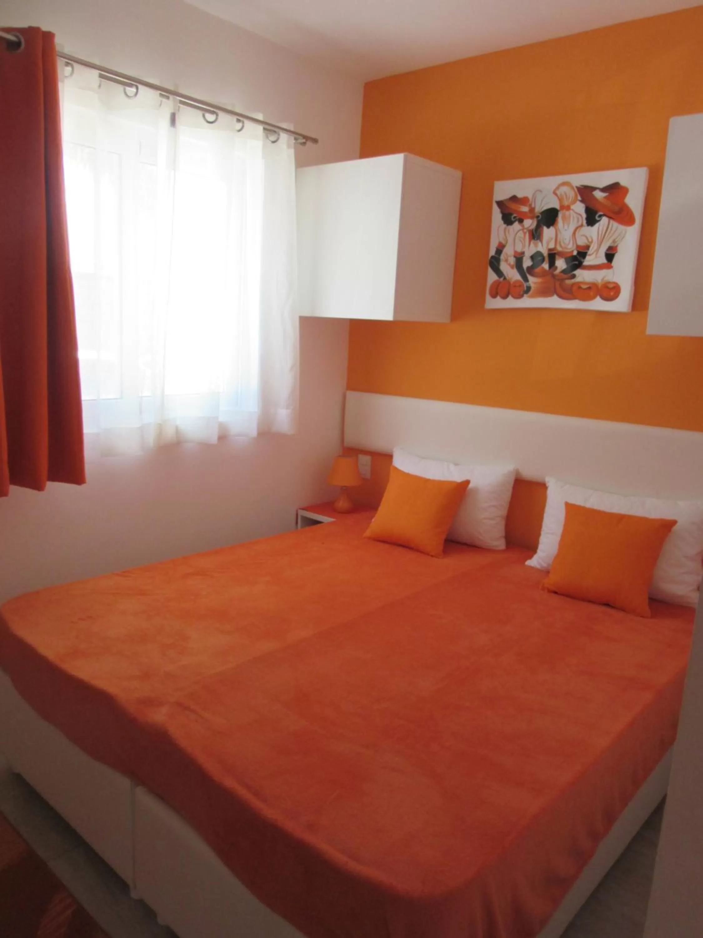 Bed in Coral Village - "Caribbean Cocktails" Deluxe Suites & Pool