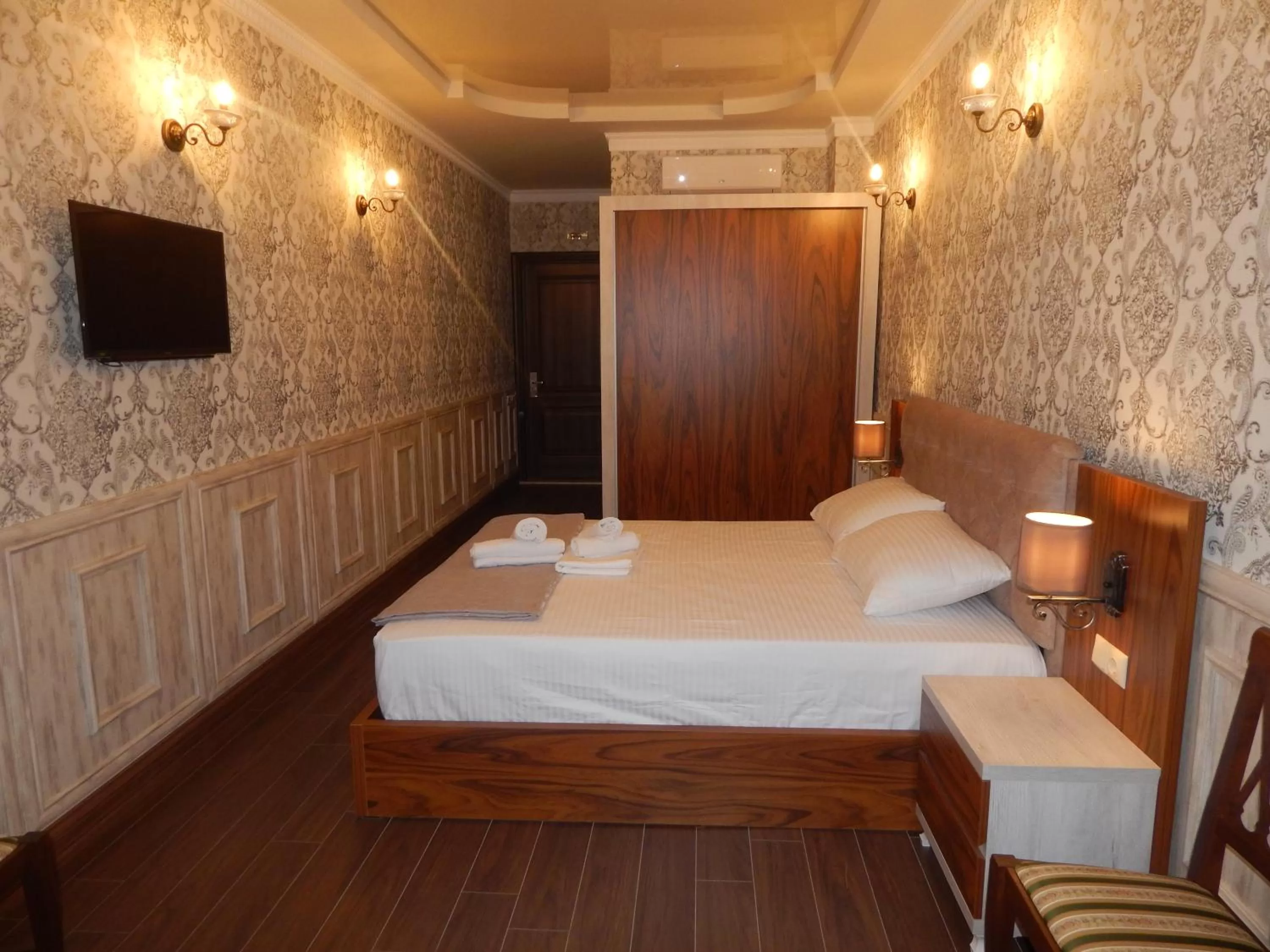 Bed in MELINI Boutique Hotel