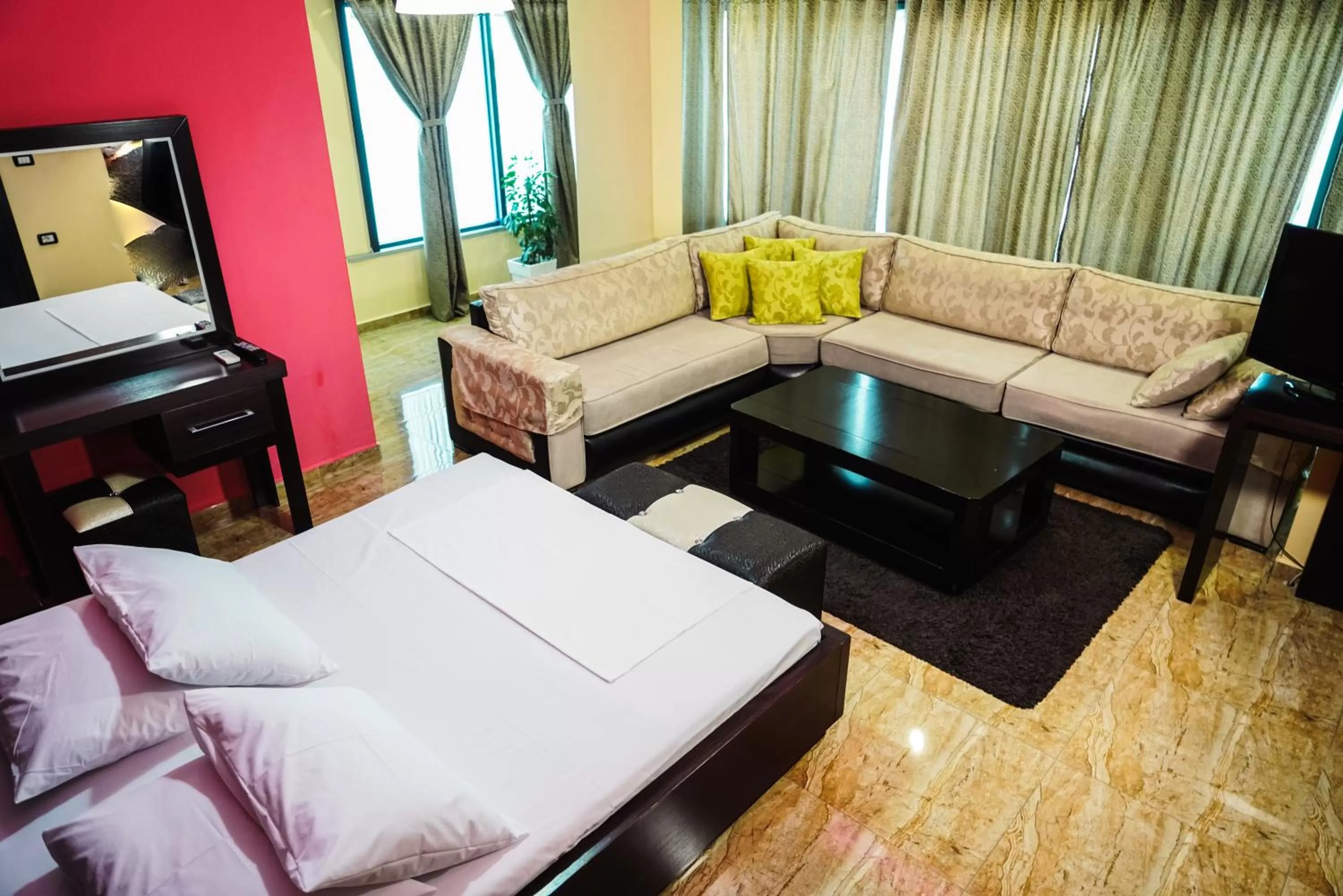 Bed, Seating Area in Hotel Magic