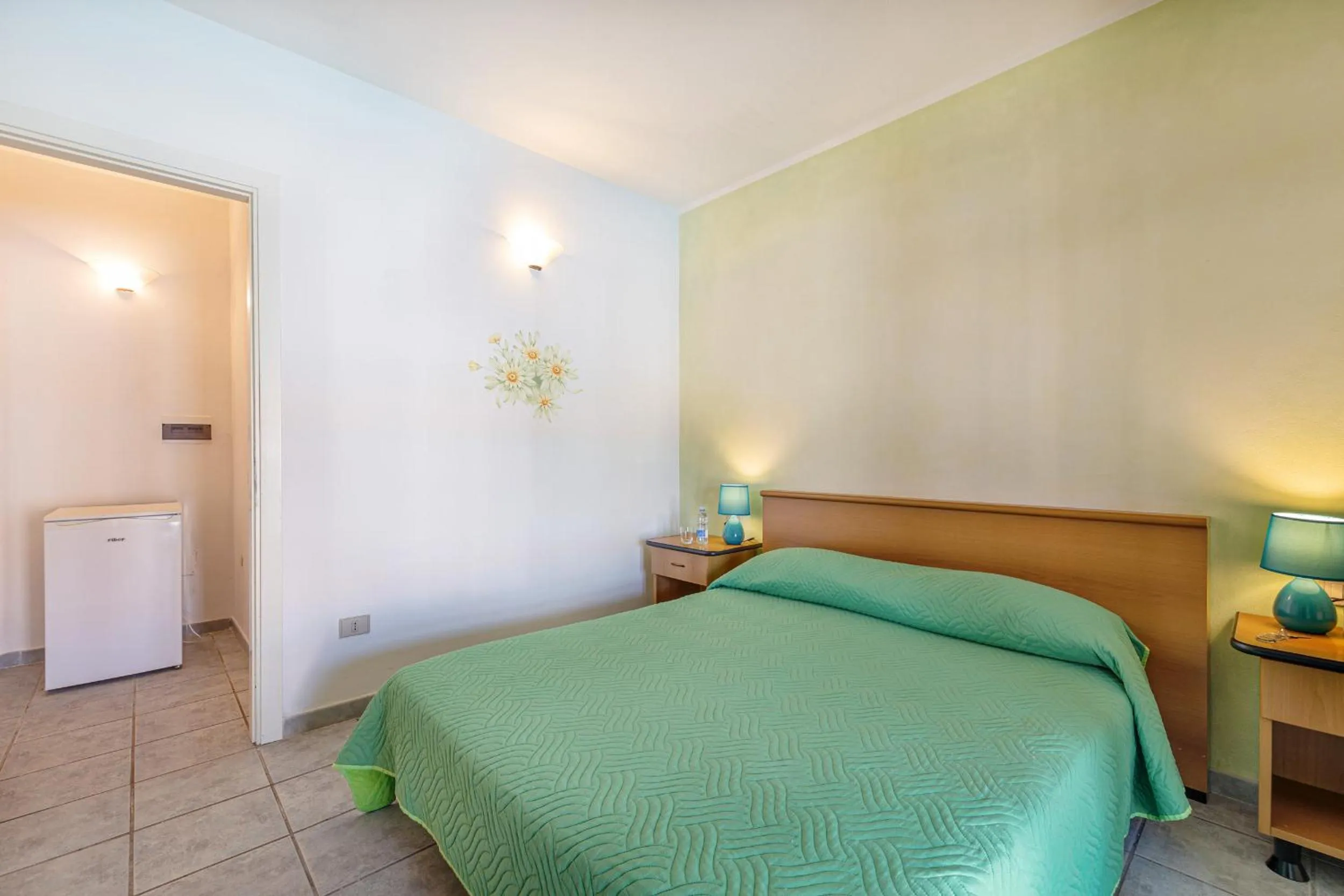 Bed in Marina Manna Hotel and Club Village