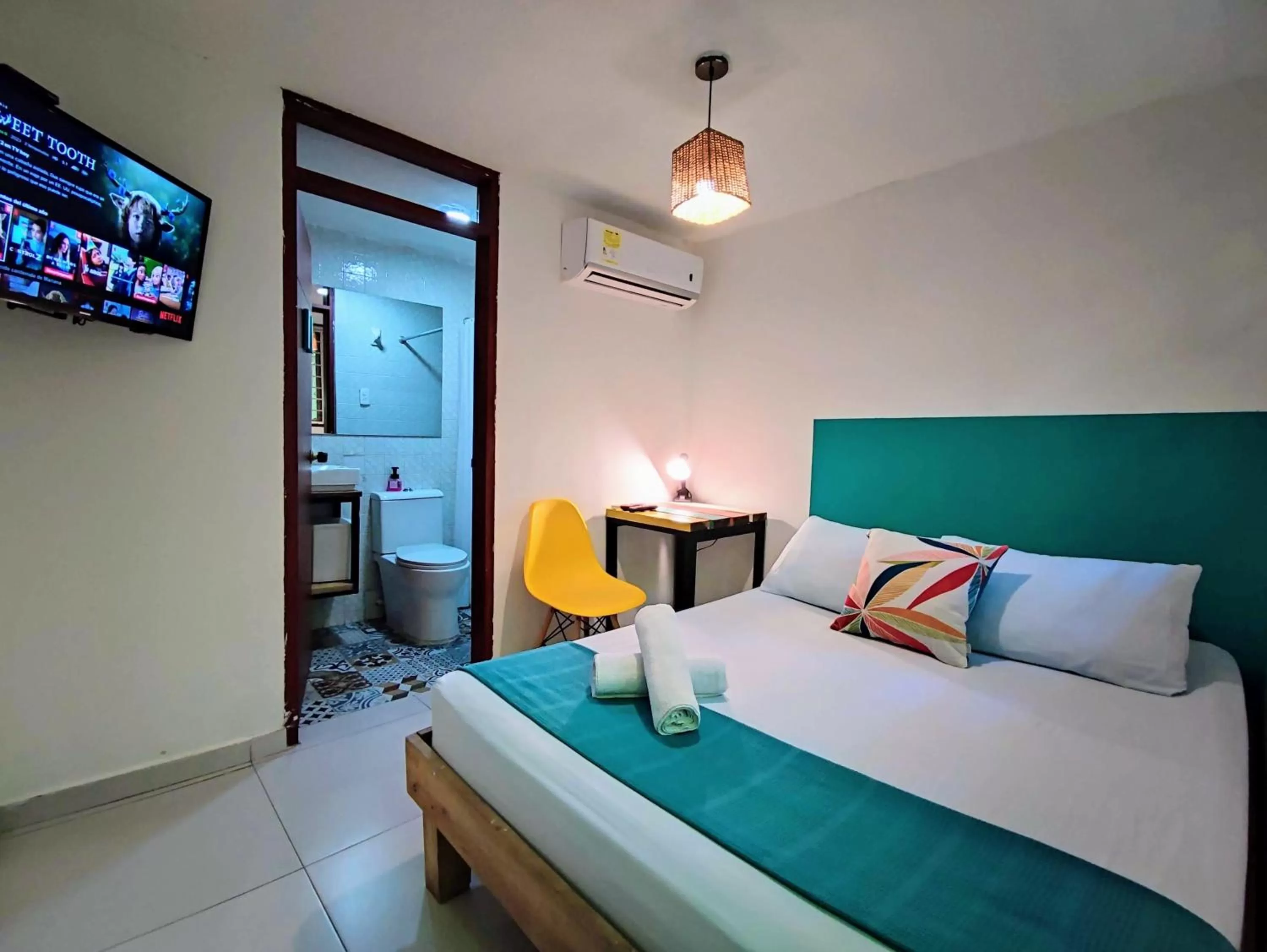 Bed in Bona Vida Hotel