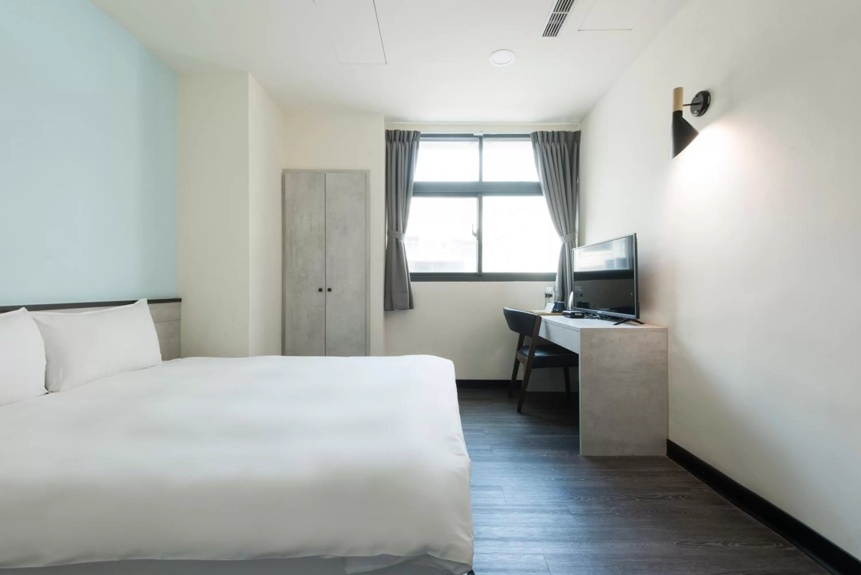 Bed in Raise Hotel Taichung