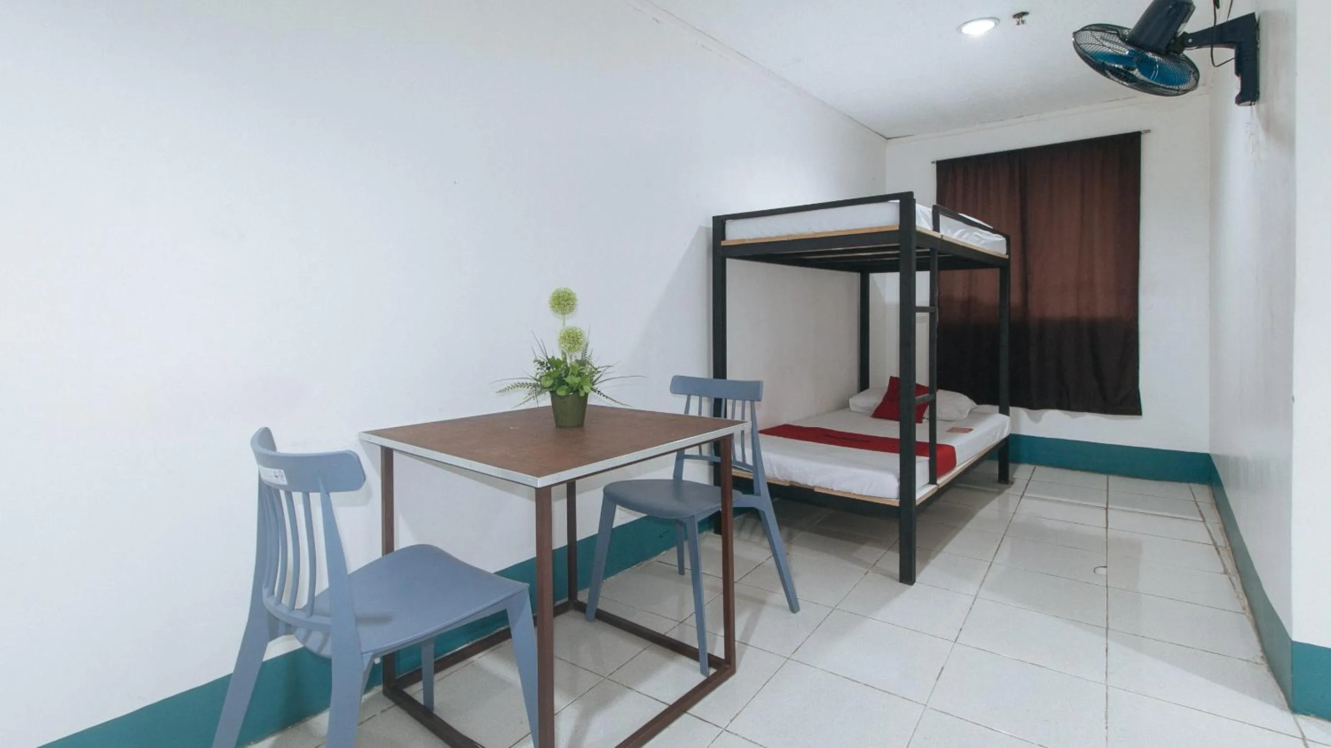 Bedroom in RedDoorz at Crowne One Condo