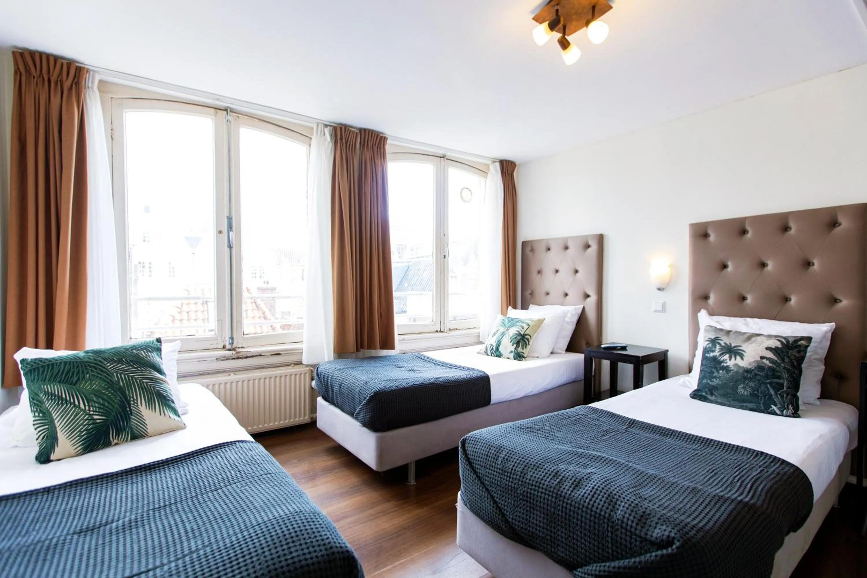 Bed in Quentin Arrive Hotel