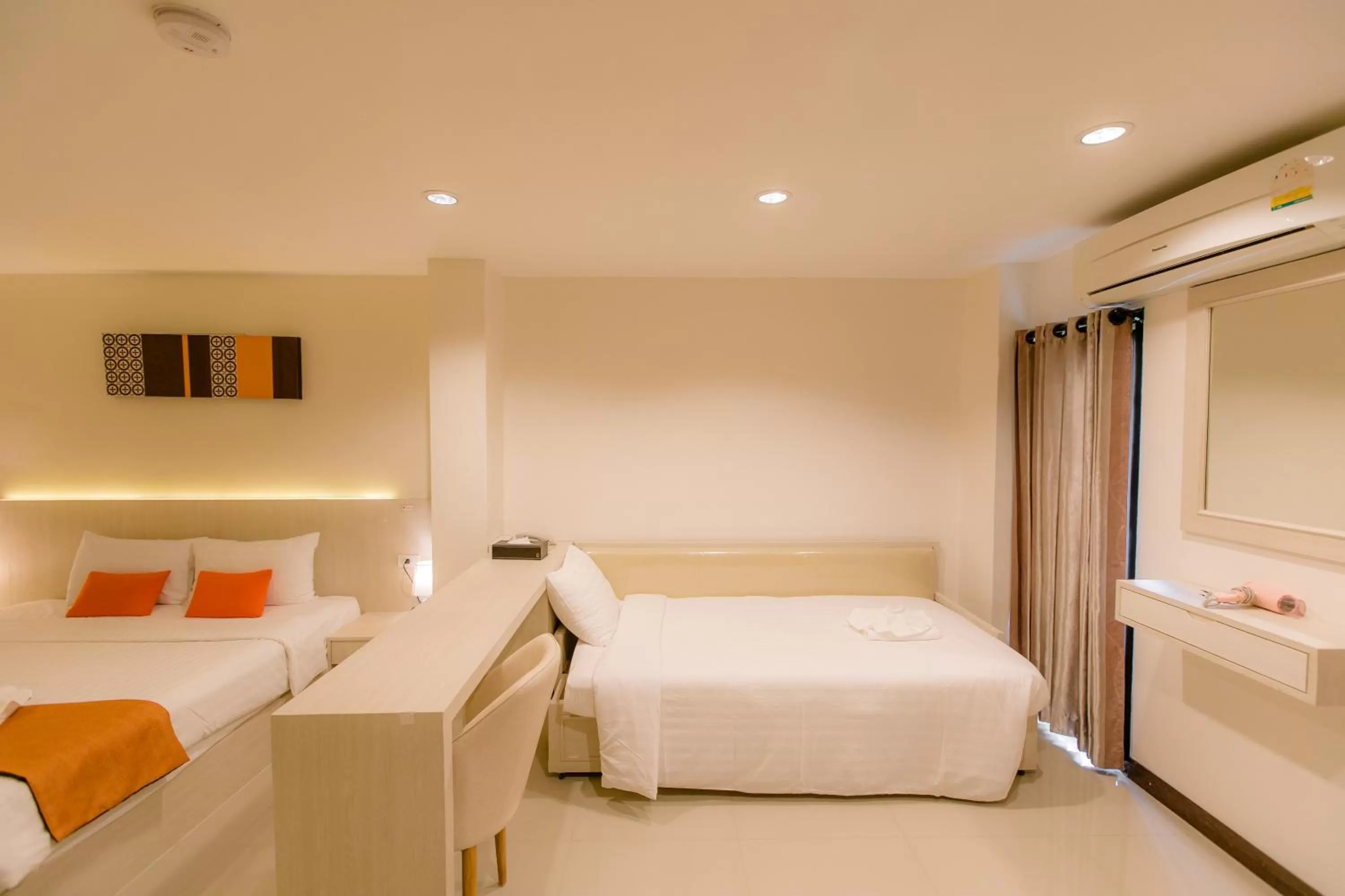 Bed in De Hug Hotel & Residence