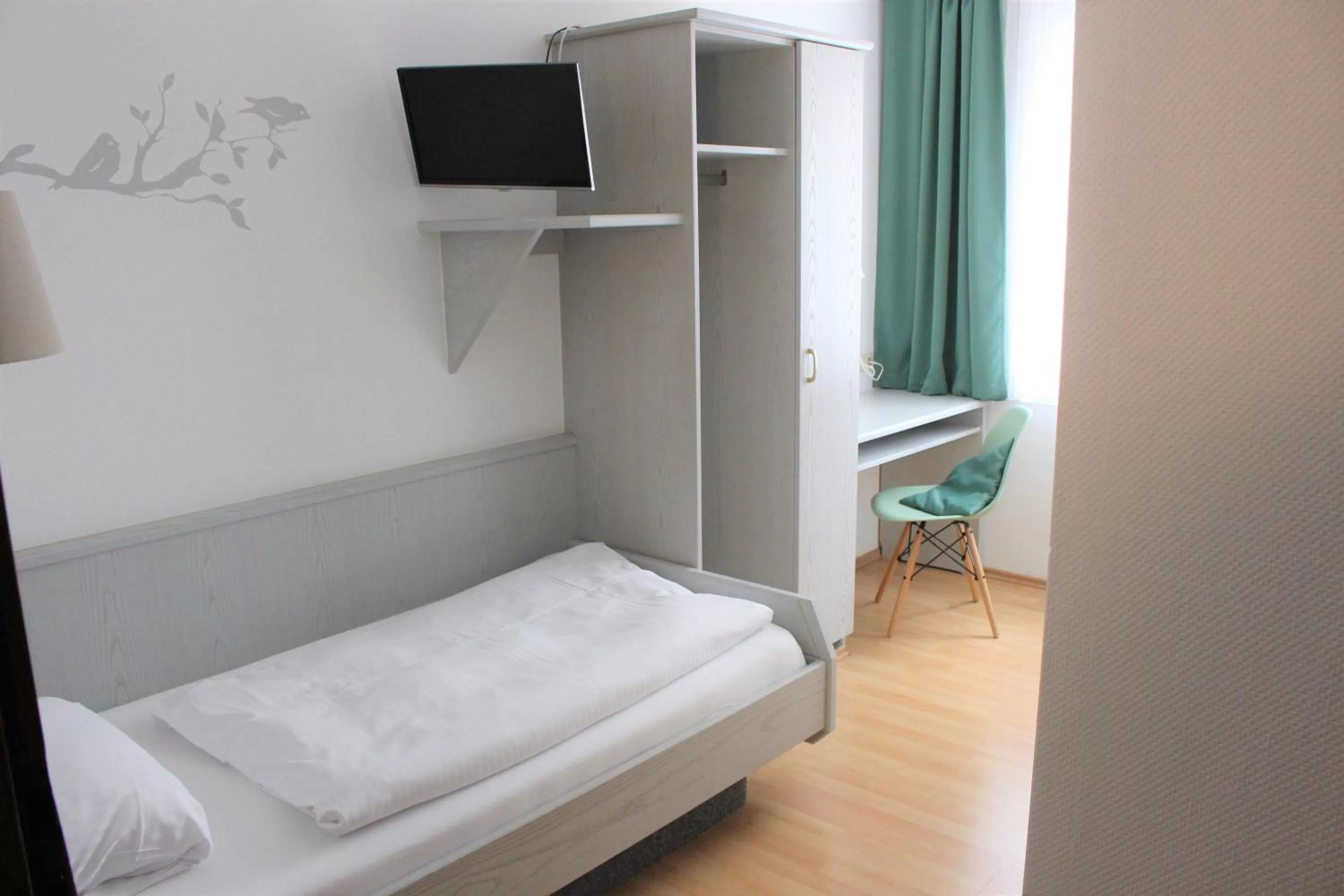 Bed in Hotel Ulmer Spatz