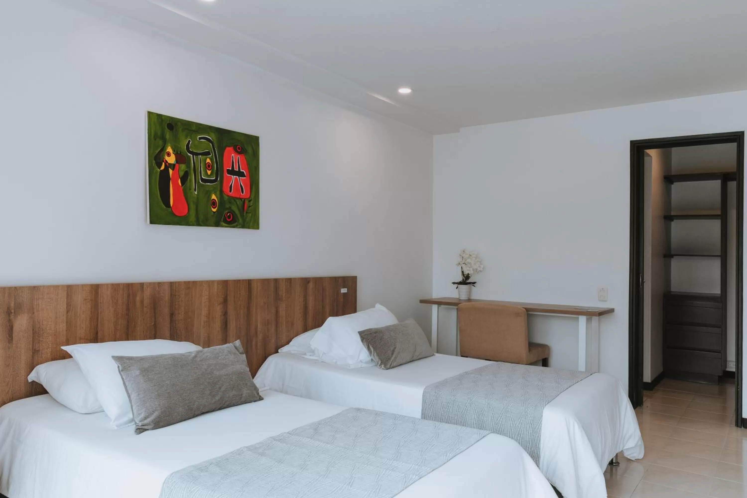 Bed in Travelers Orange Suites