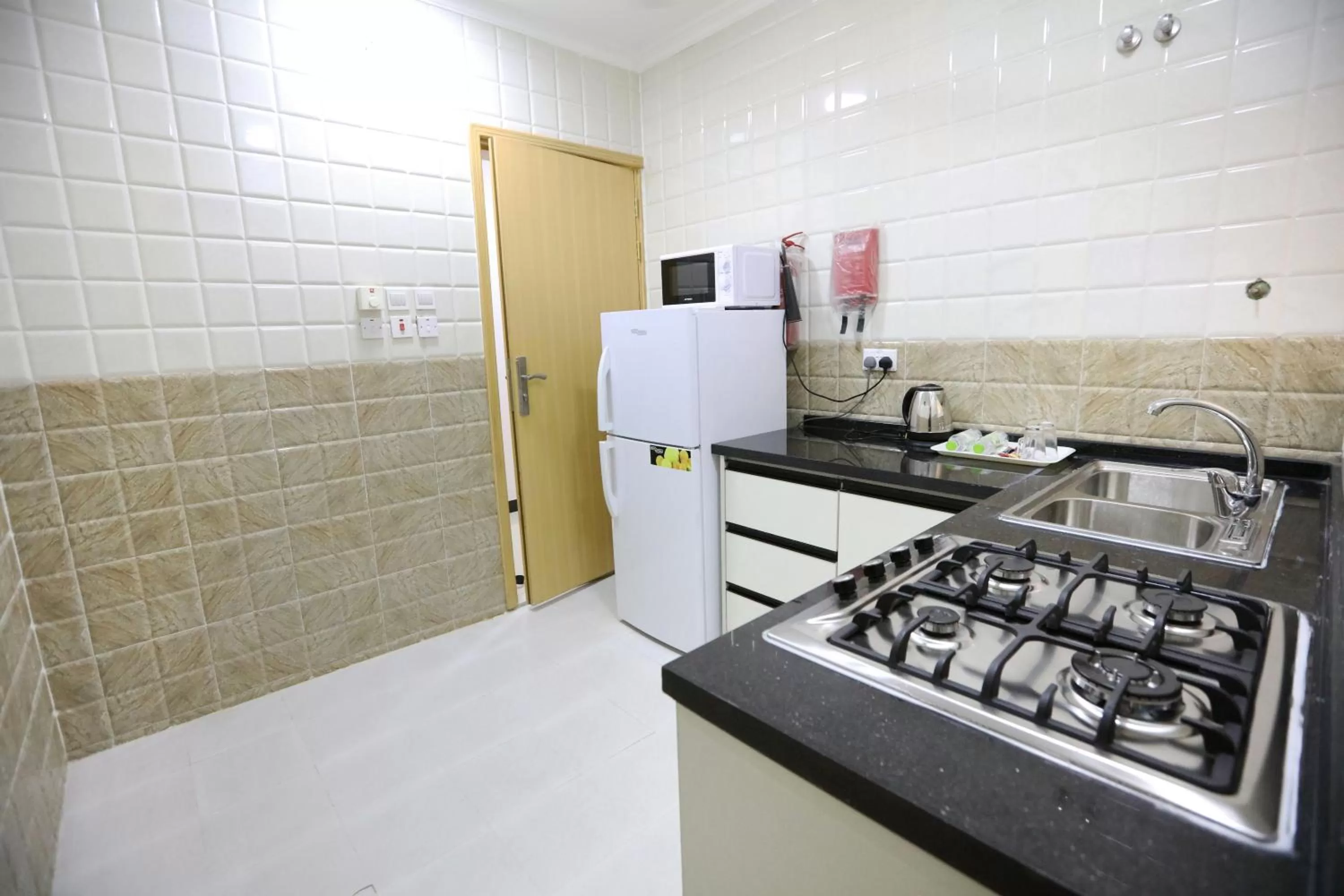 Kitchen or kitchenette in Al Rayyan Hotel Apartments Muscat
