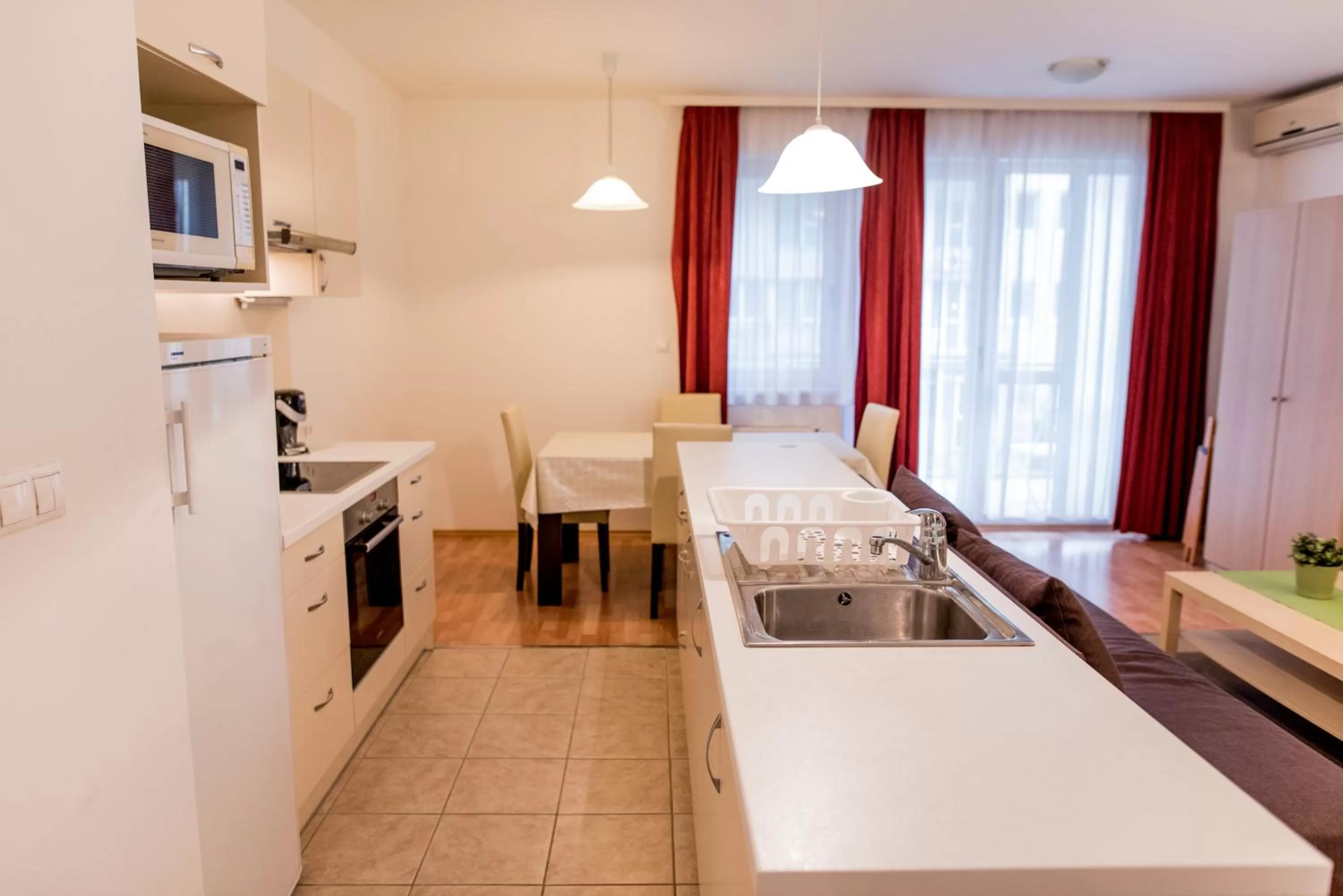 Kitchen or kitchenette in Agape Apartments
