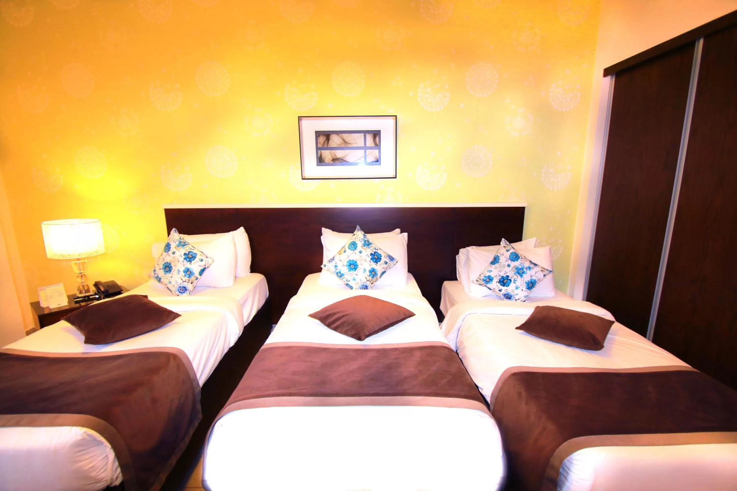 Bed in City Rose Hotel Suites