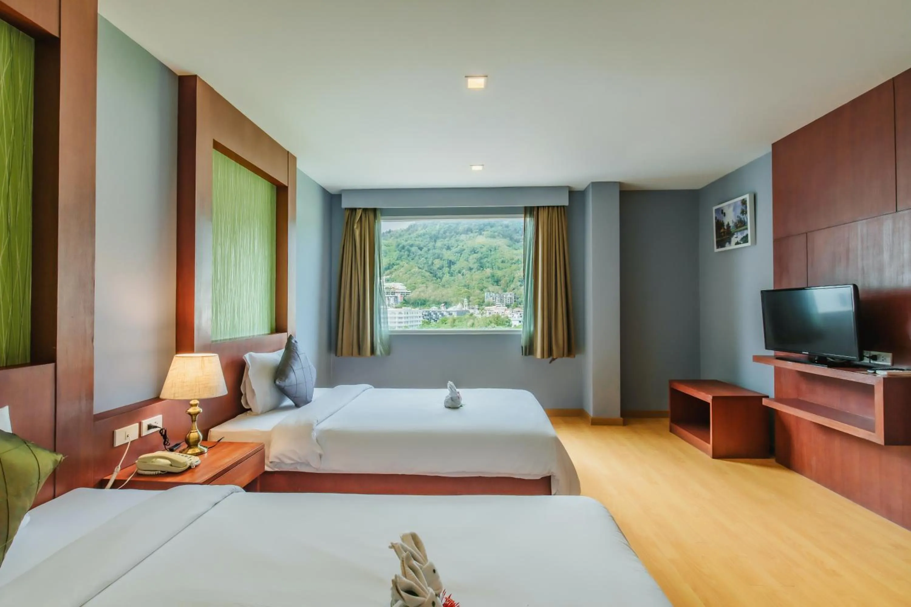 Bed in Elite Suites Patong