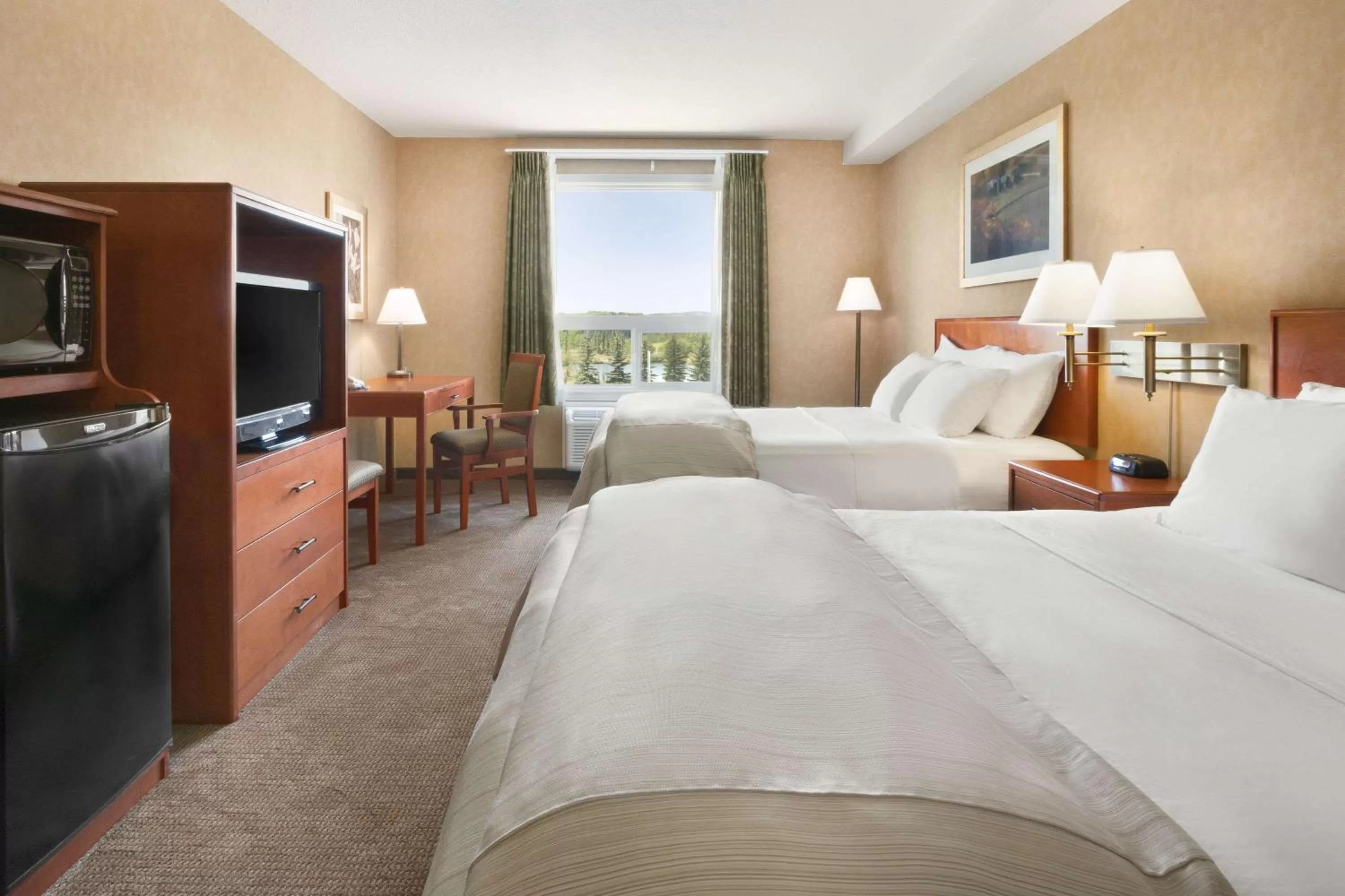 Photo of the whole room, Bed in Days Inn & Suites by Wyndham Cochrane