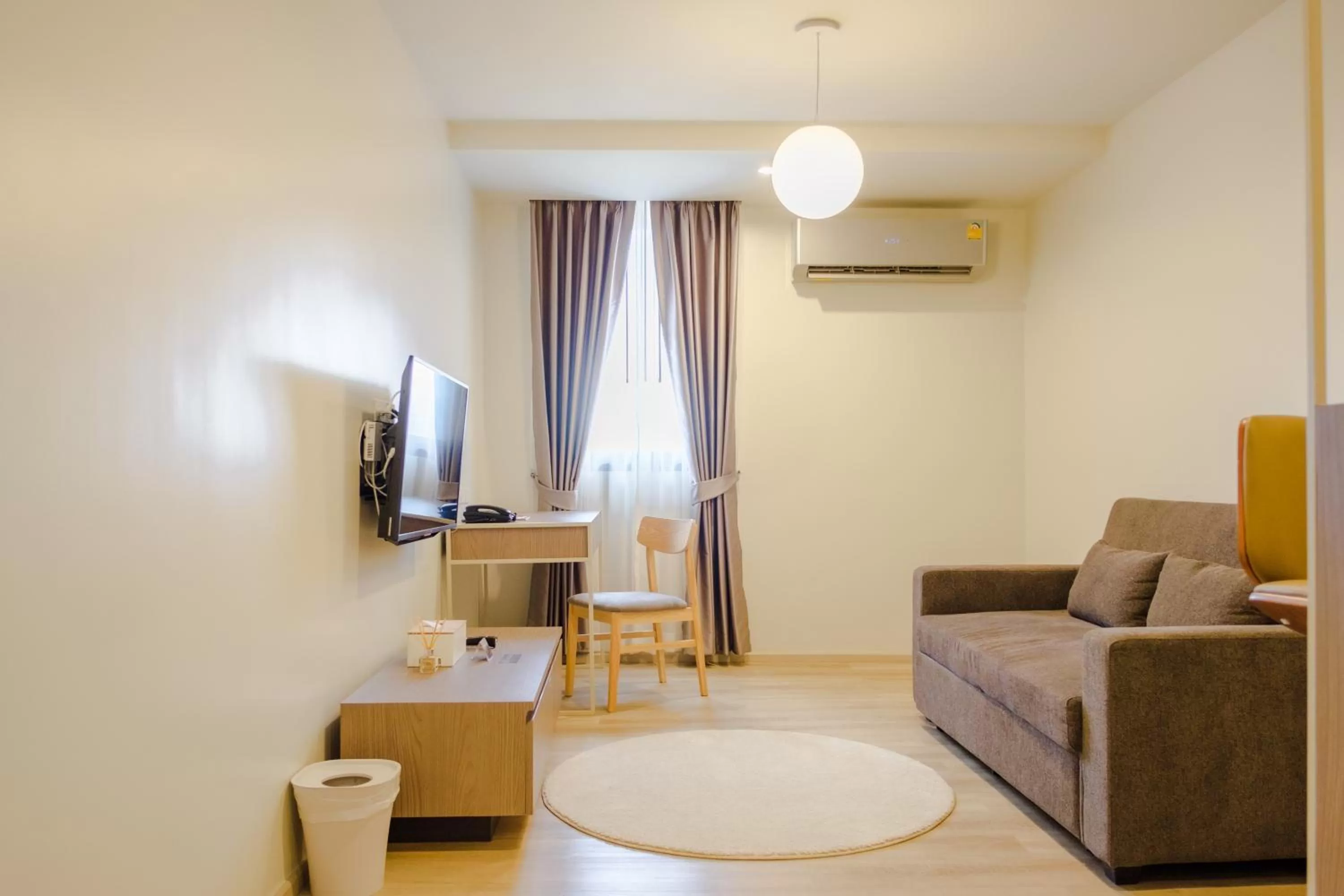 Living room in The Rise Suites Hotel, Chiang Mai - SHA Extra Plus