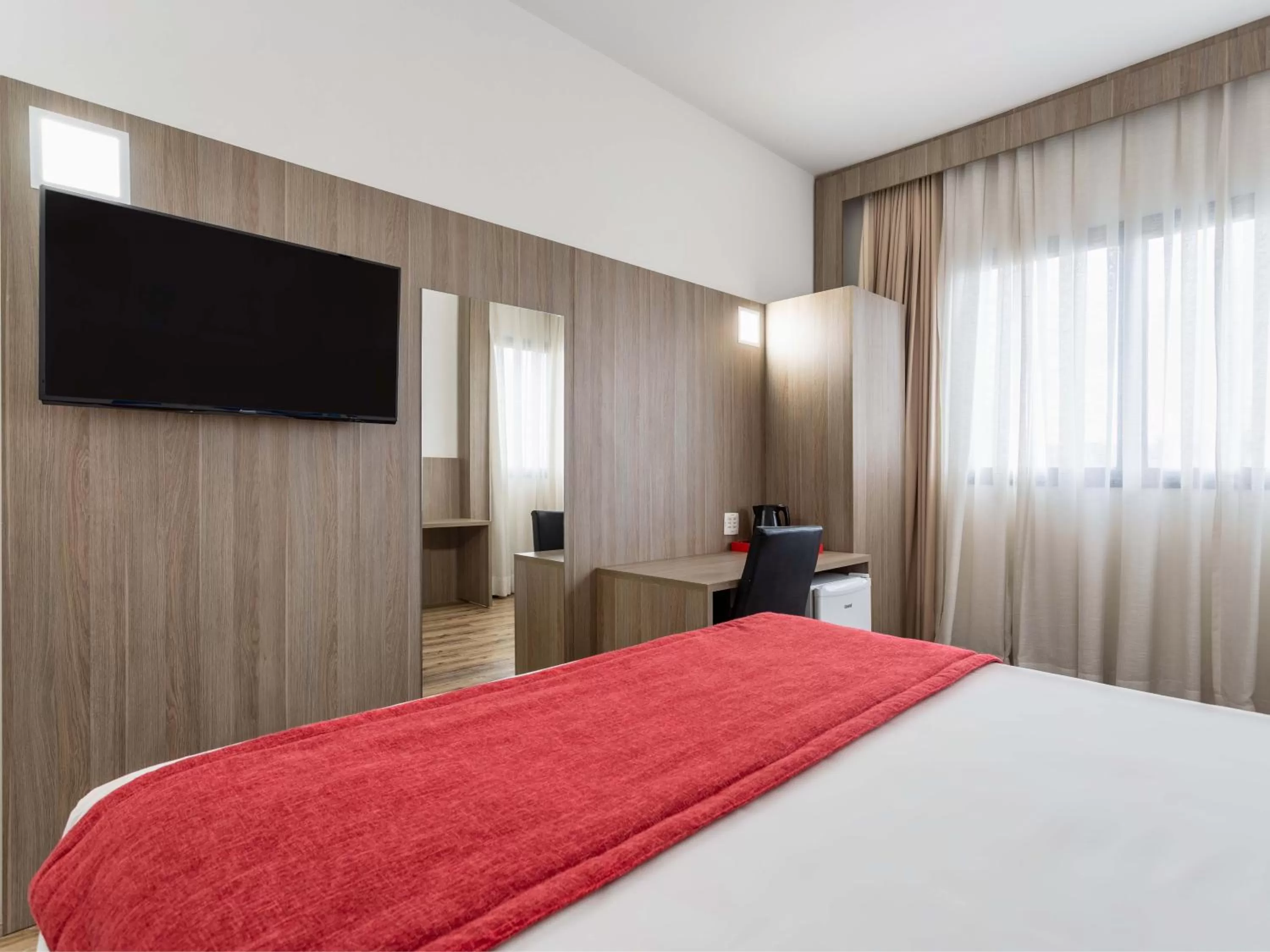 Bed in Ramada Encore by Wyndham São Paulo Osasco