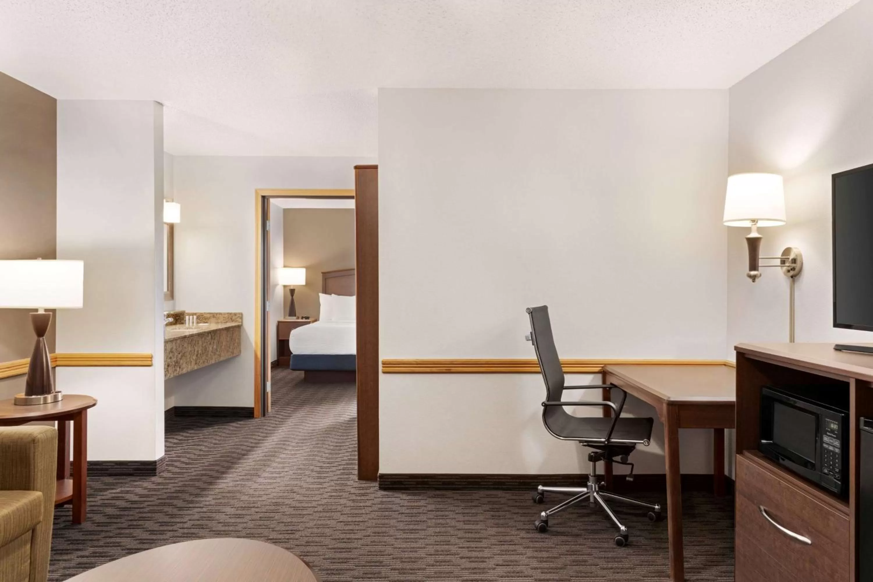 Bed in AmericInn by Wyndham Baudette