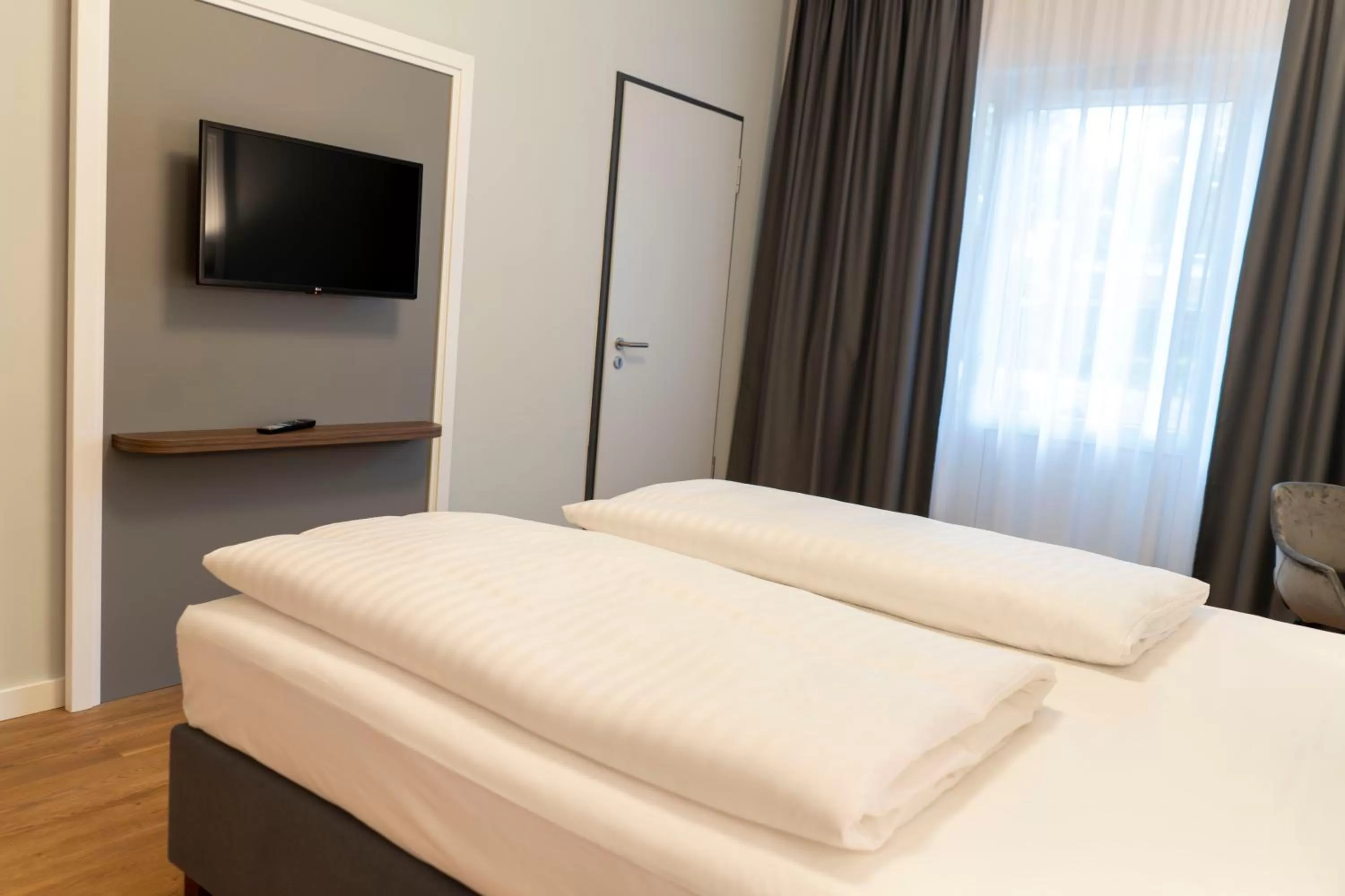 Bed in Signature Hotel Skarv