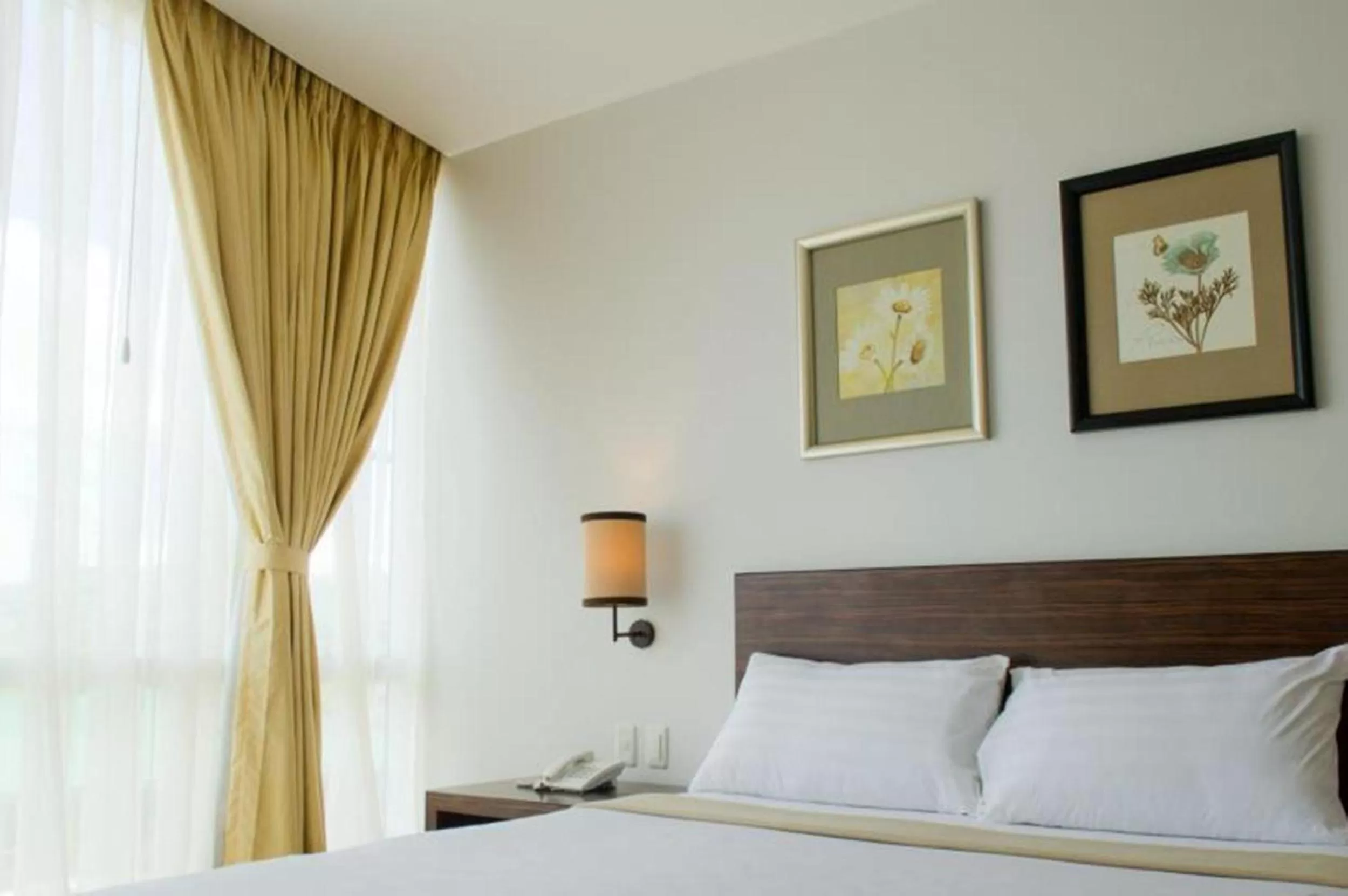 Bed in D'Hotel & Suites