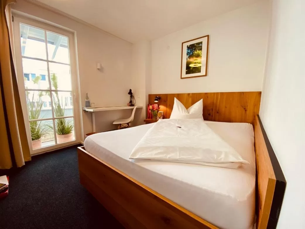 Photo of the whole room, Bed in Stadthotel Waldhorn