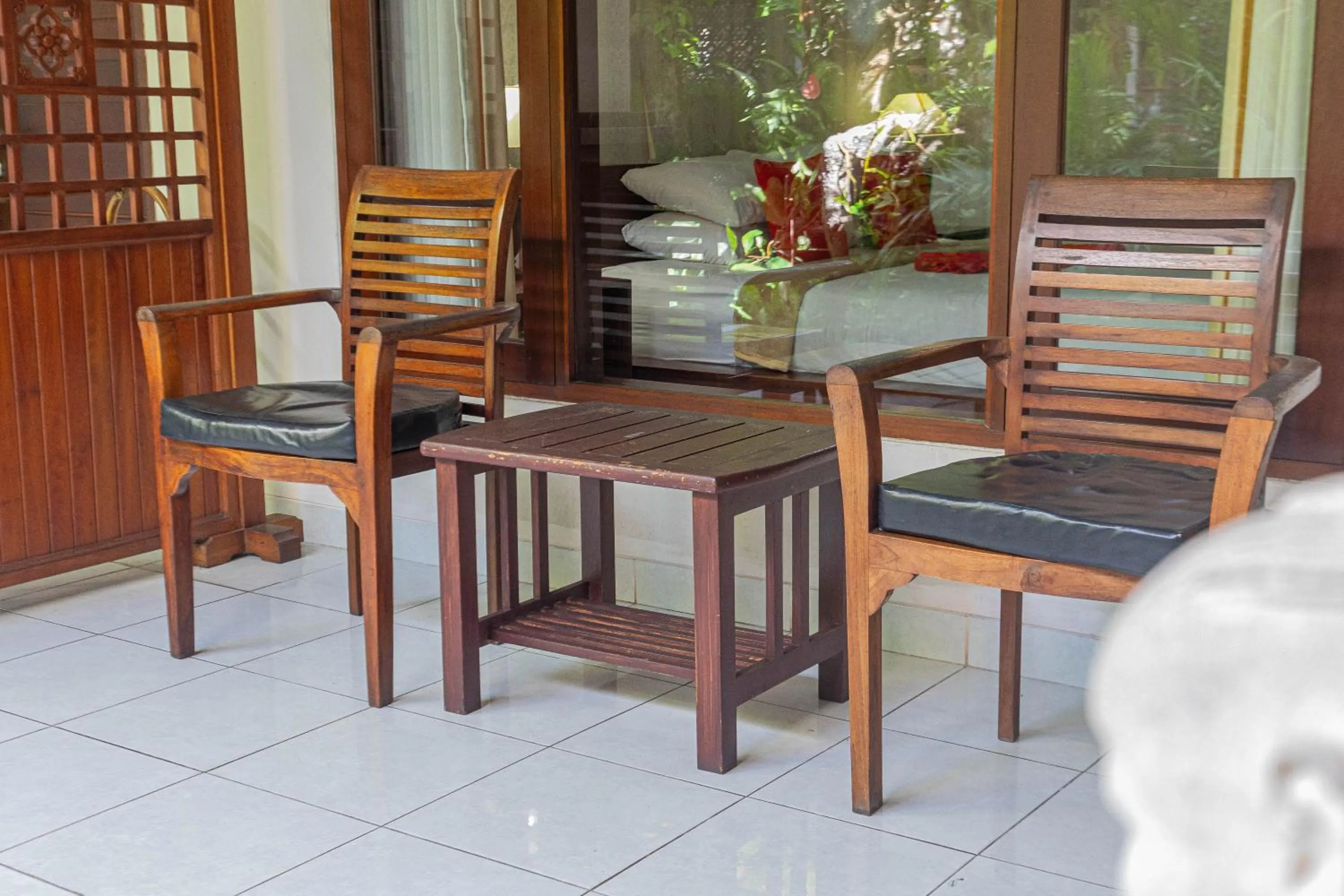 Seating area in Puri Mango Guest House Sanur