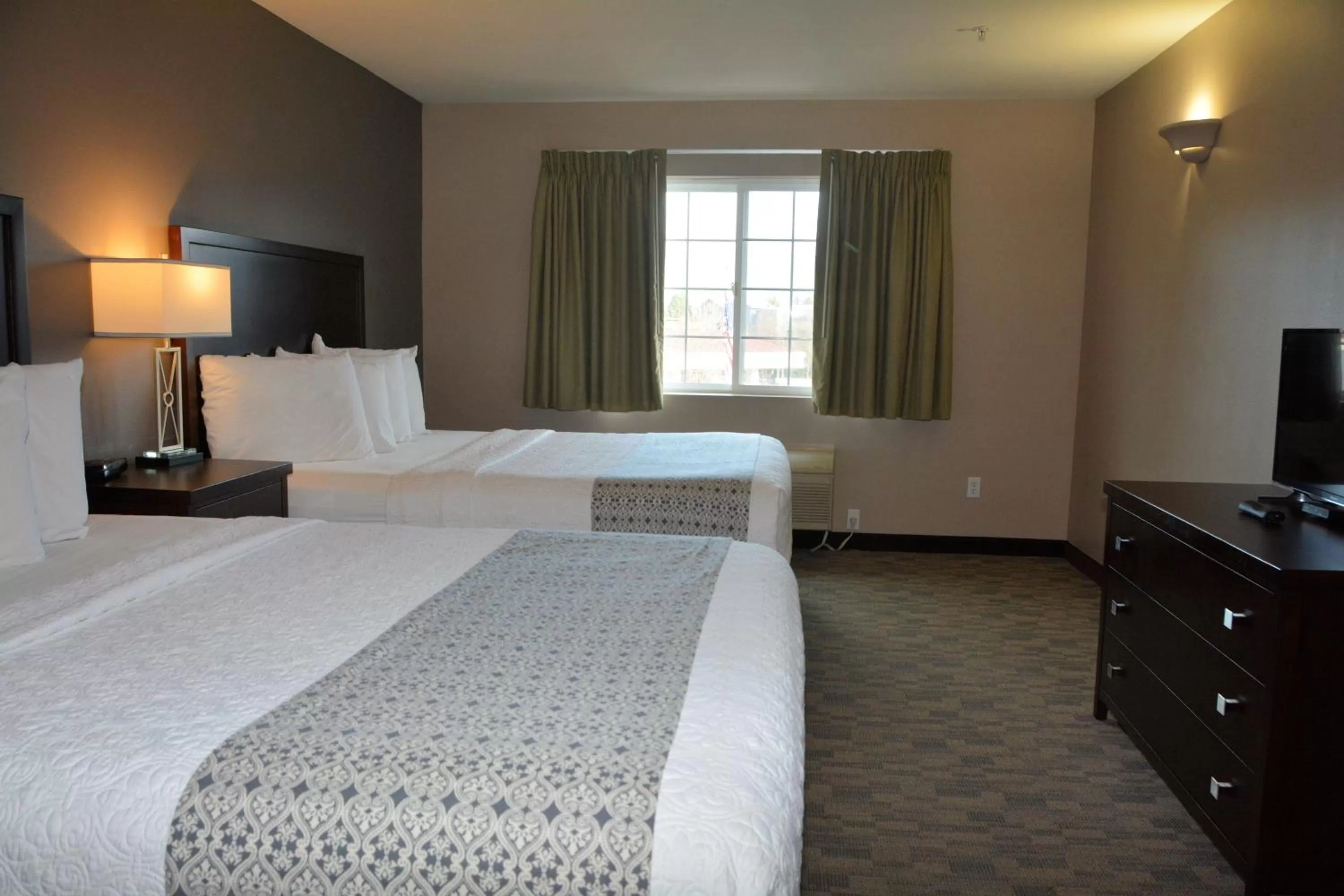 Bed in FairBridge Inn & Suites DuPont