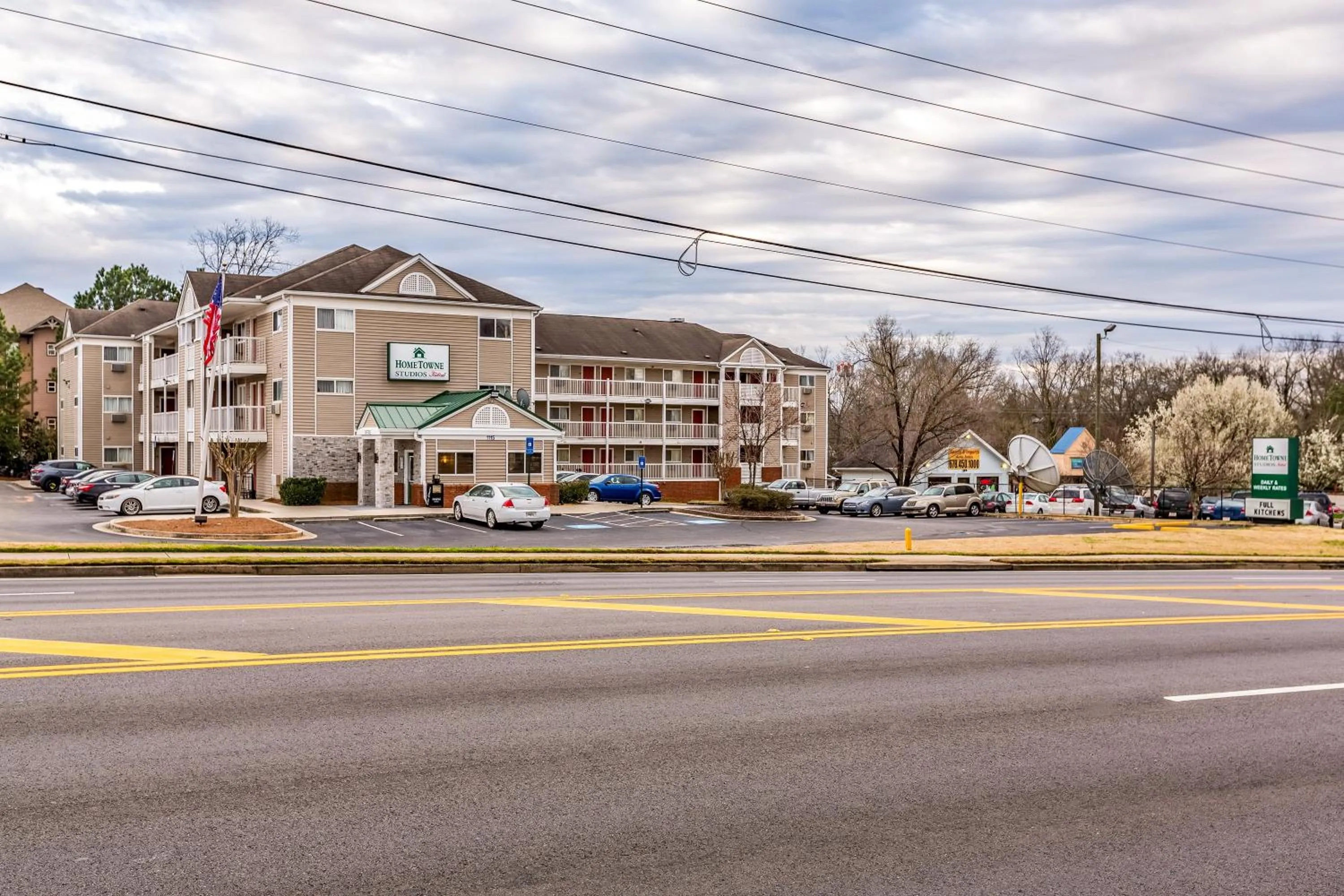 Property building in HomeTowne Studios by Red Roof Gainesville, GA