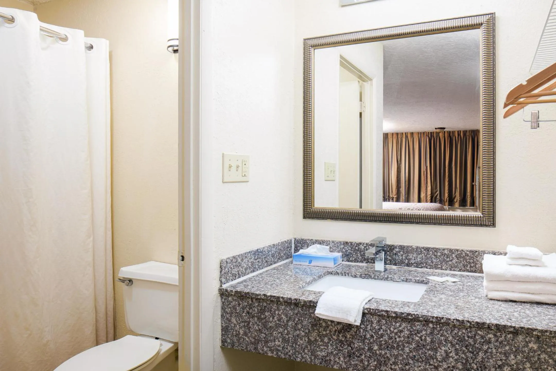 Bathroom in Americana Inn a Travelodge by Wyndham