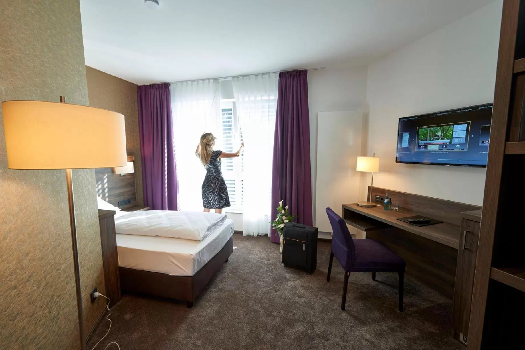 TV and multimedia, TV/Entertainment Center in Hotel Mühlenhof Lollar