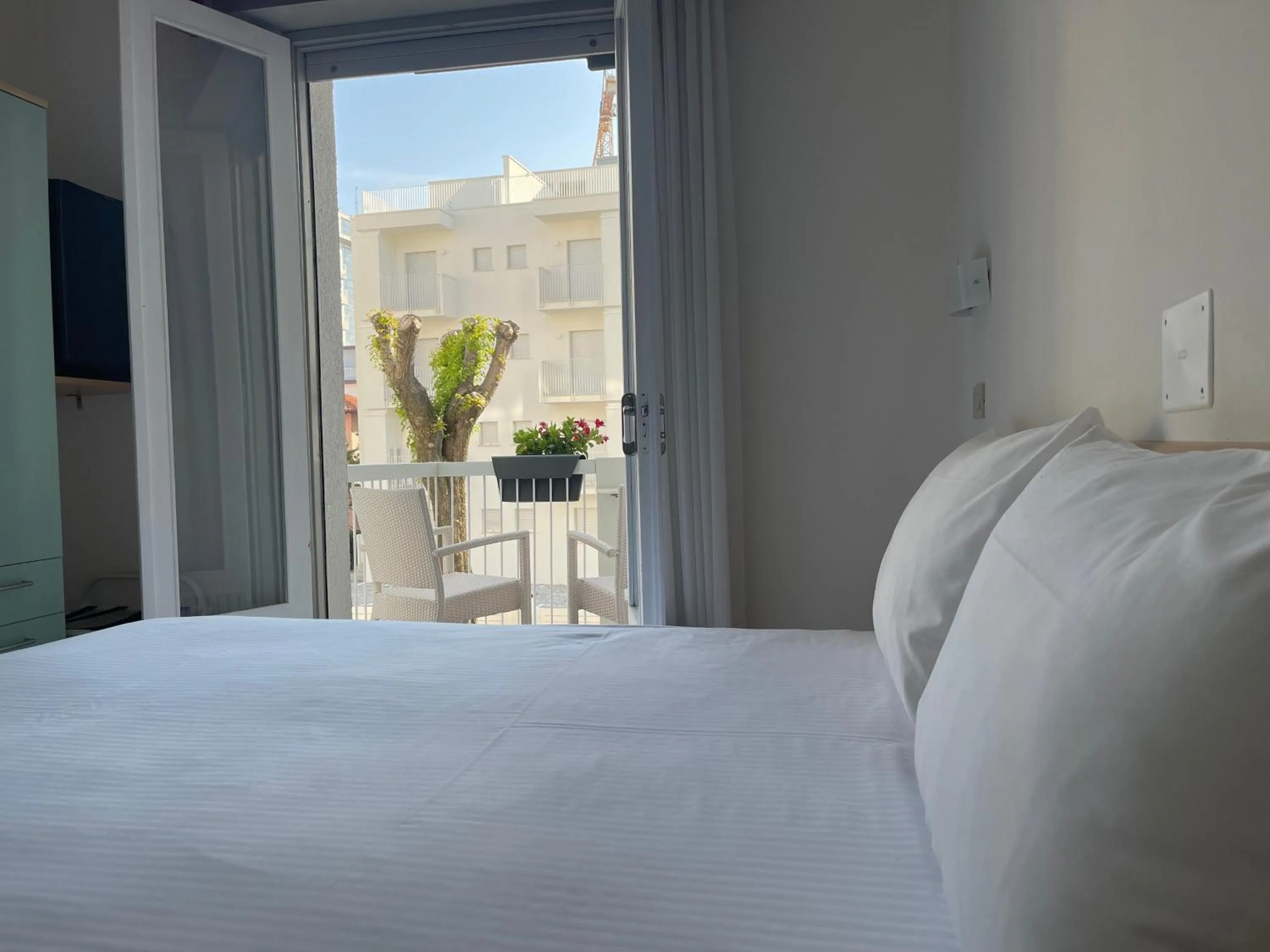 Balcony/Terrace, Bed in Hotel Athena