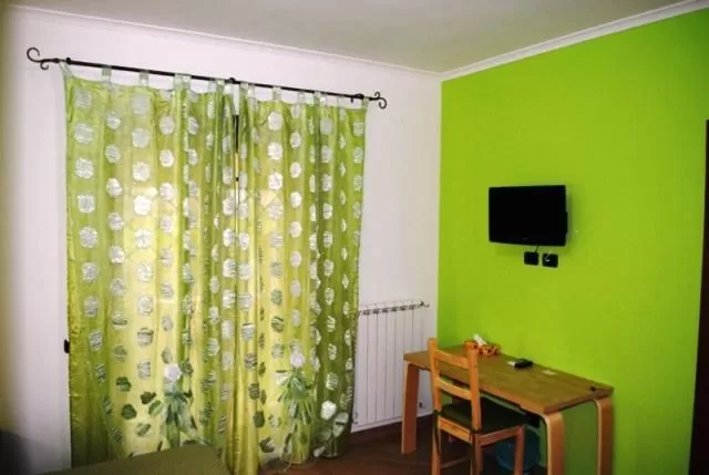 Photo of the whole room, TV/Entertainment Center in B&B Insula Portus