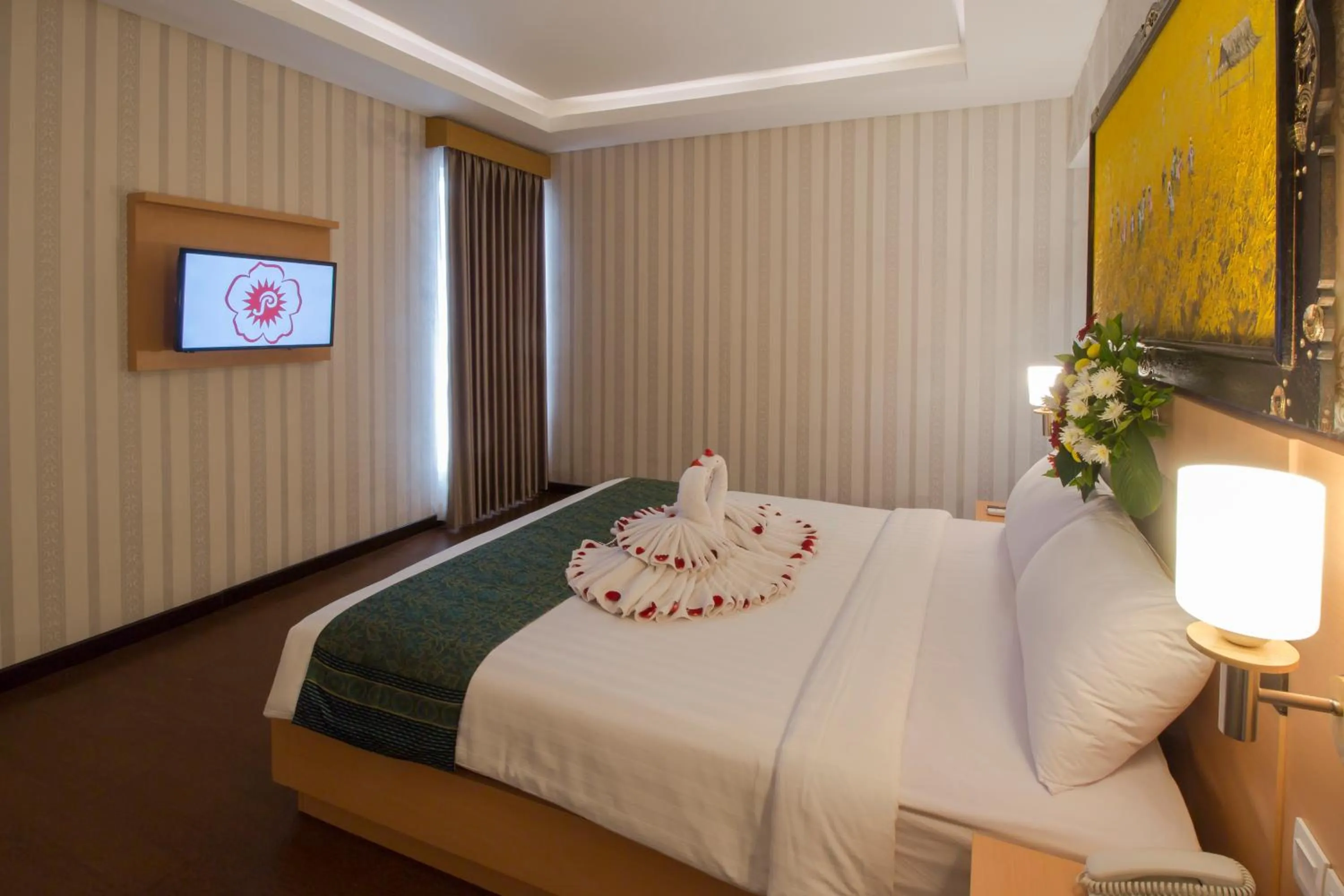 Bed in Grand Puri Saron Hotel Yogyakarta