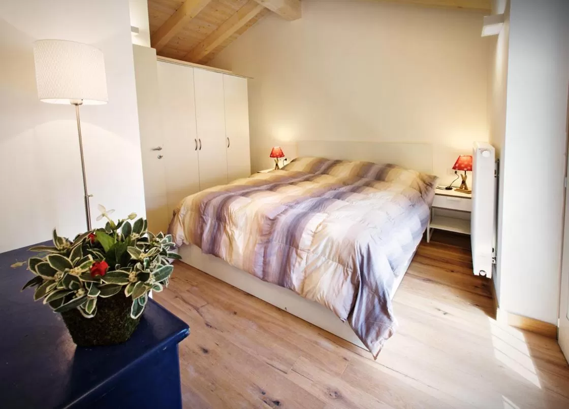 Photo of the whole room, Bed in Albergo Diffuso Tolmezzo