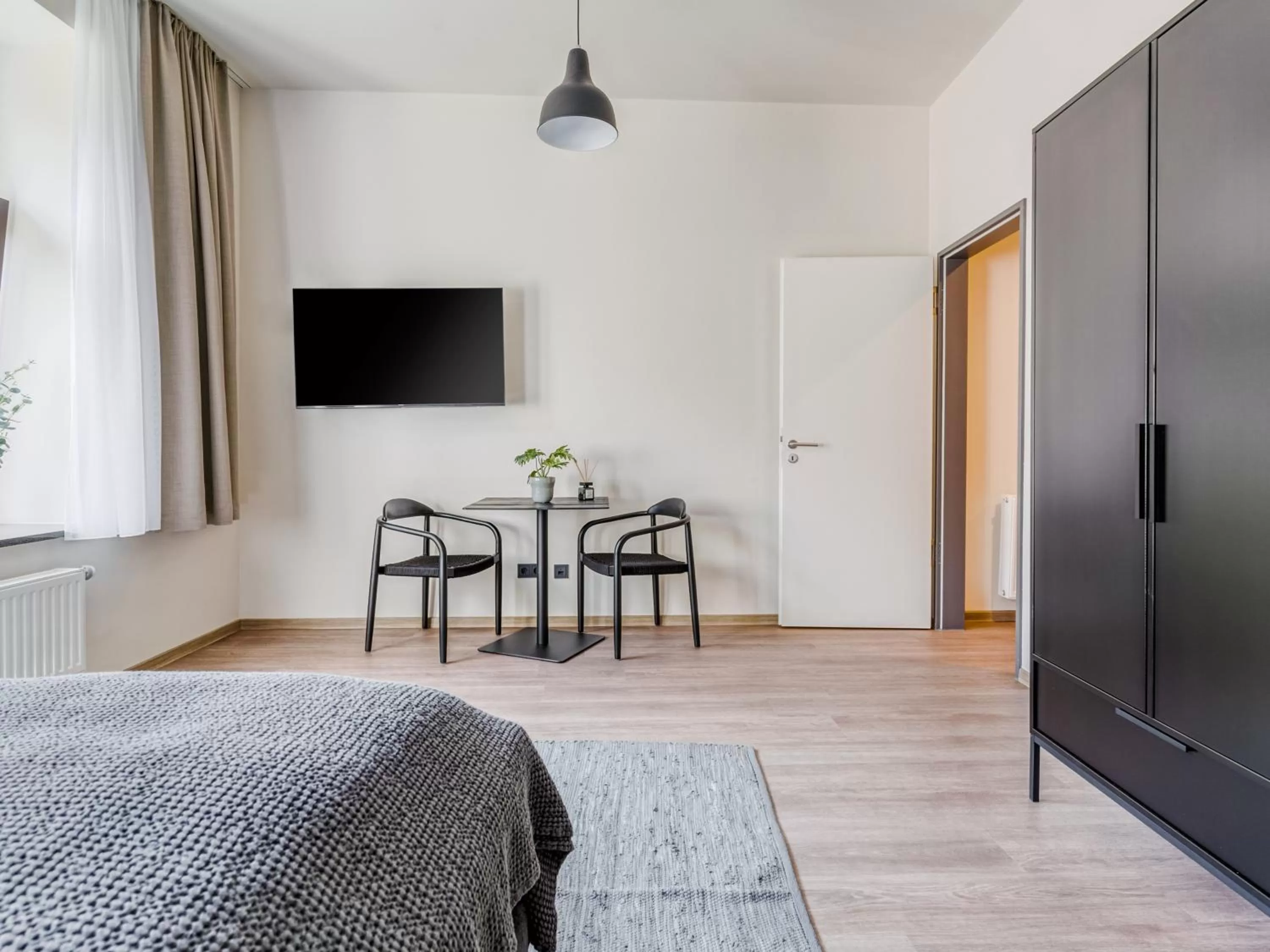 Seating area, Bed in Limehome Leipzig Oelßner's Hof