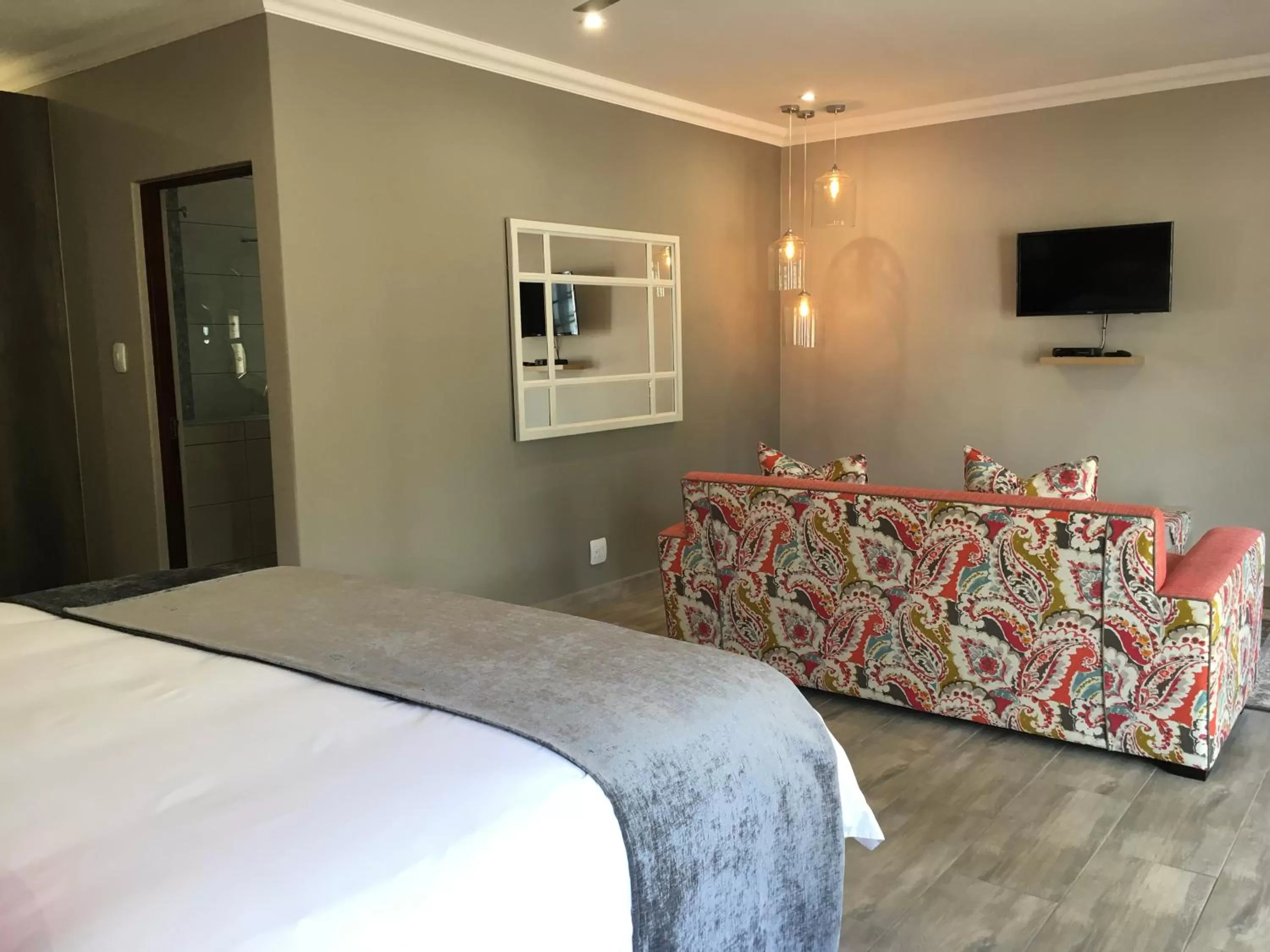 Seating area, Bed in Nut Grove Boutique Hotel