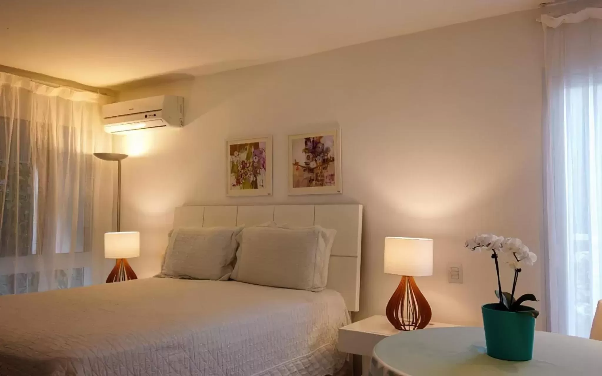 Bed in Guest House Guarujá