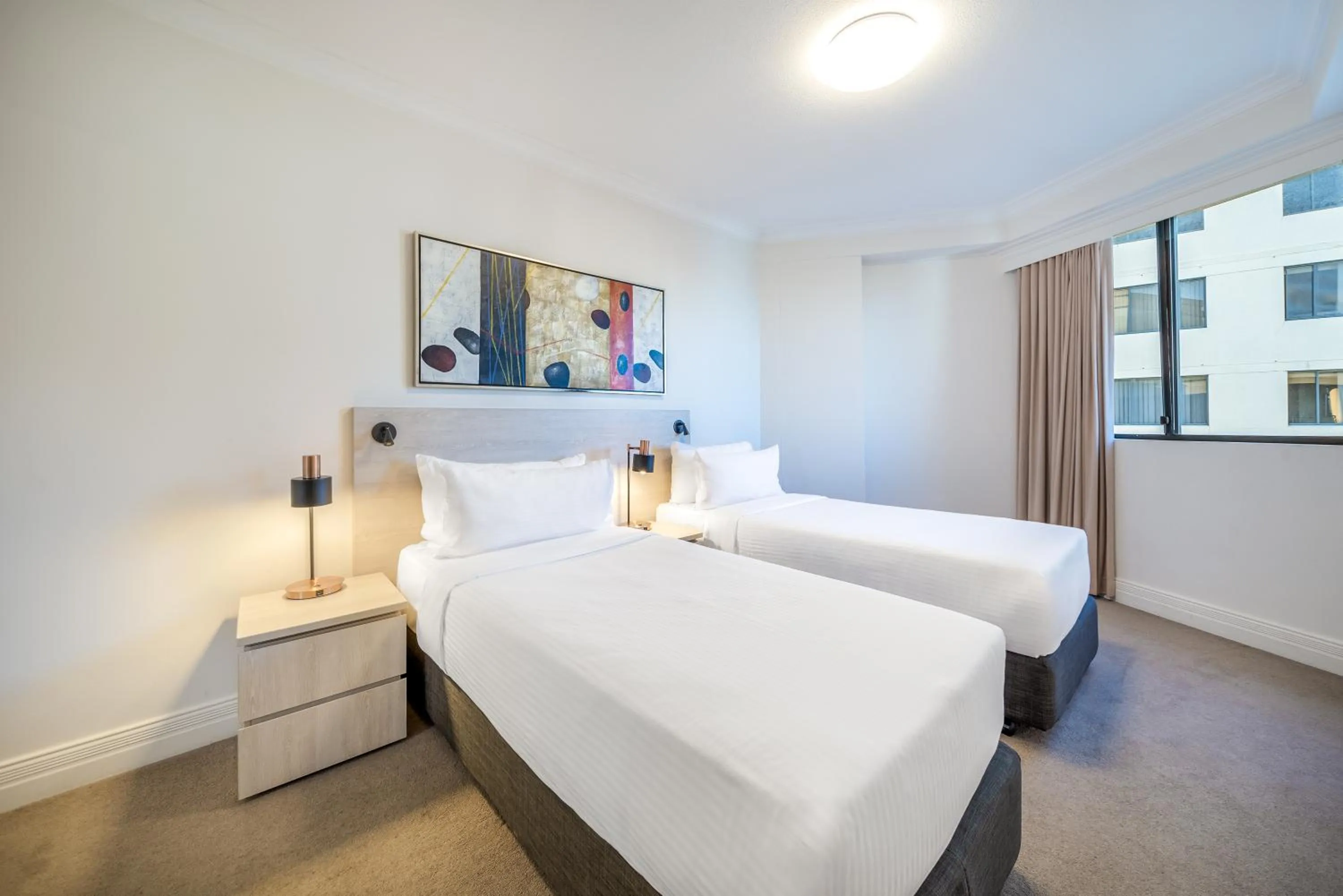 Bed in Oaks Sydney Castlereagh Suites