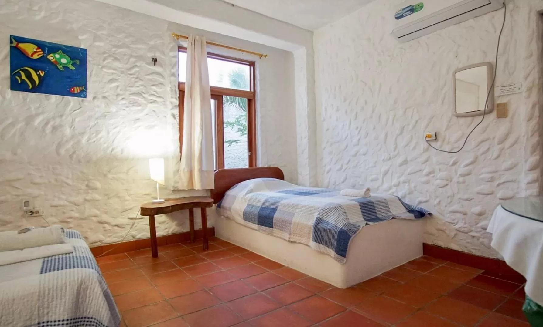 Bed in Hostal Galapagos by Bar de Beto